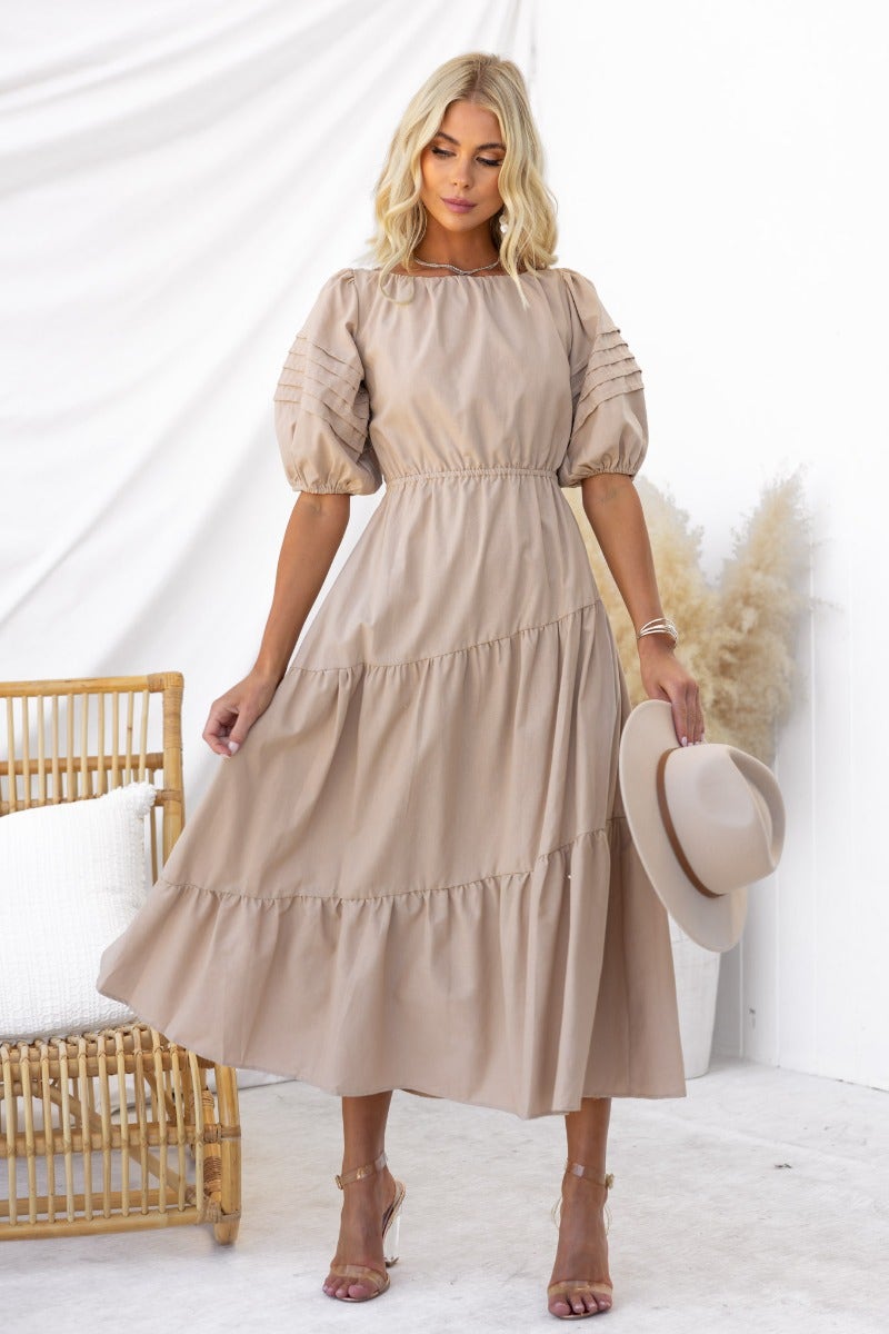 Oteo Midi Dress in taupe, featuring puff sleeves, a boat neckline, and a tiered skirt perfect for summer occasions.
