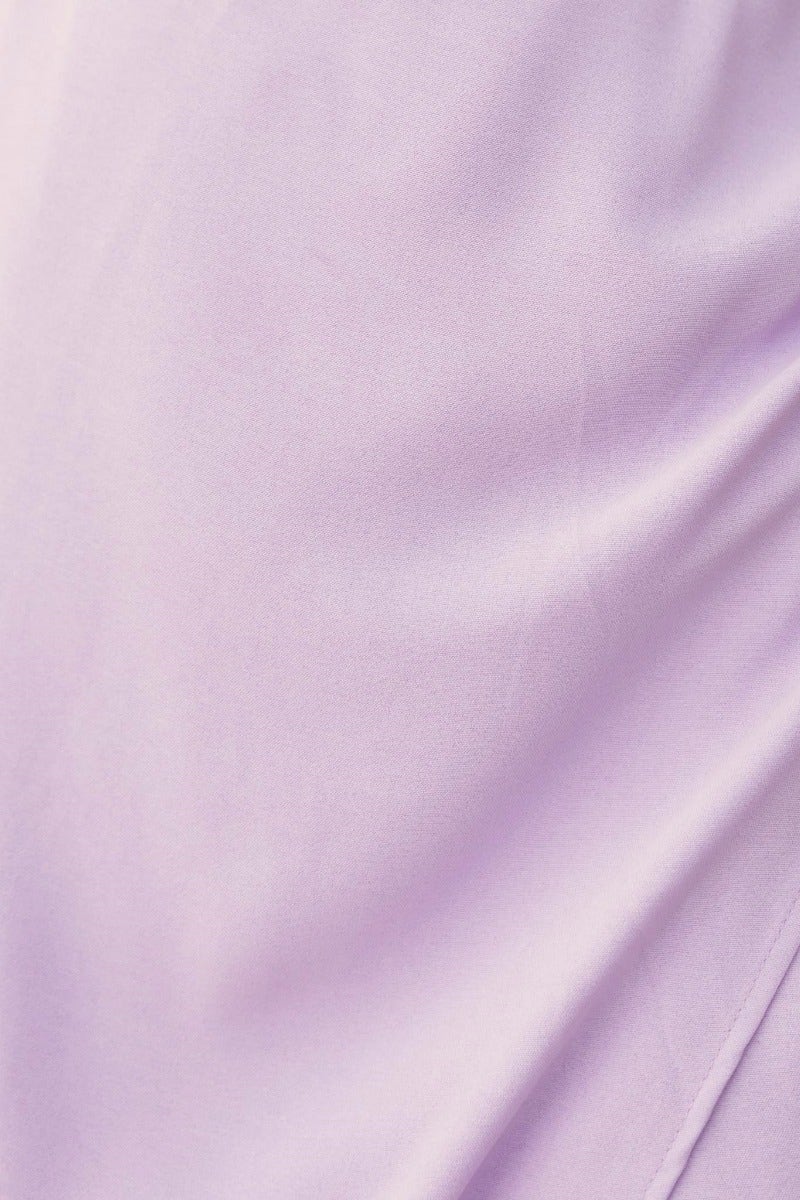 Close-up of soft lavender fabric, showcasing its smooth texture for the Slow Down Maxi Dress.