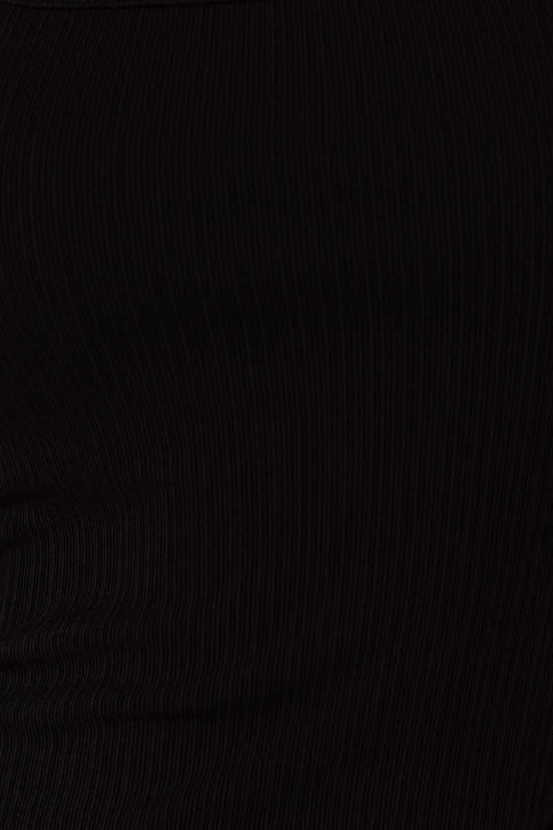 Close-up of black ribbed fabric of the Dion Midi Dress, showcasing its bodycon style and stretch material.