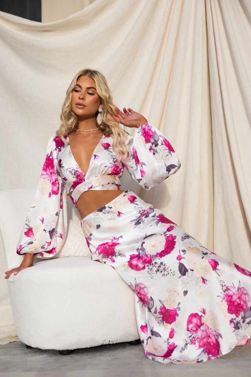 Floral print satin wrap set with elastic sleeve cuffs and non-stretch maxi skirt, model posing gracefully.