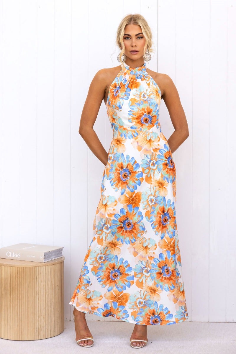 Floral print satin maxi dress with high tie neckline and invisible zip at back, featuring vibrant blue and orange flowers.