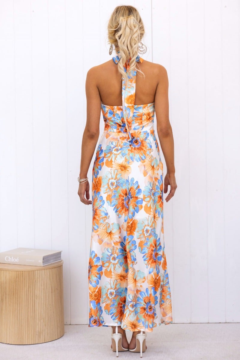 Back view of the Forbidden Love Maxi Dress featuring floral print and halter neck design.