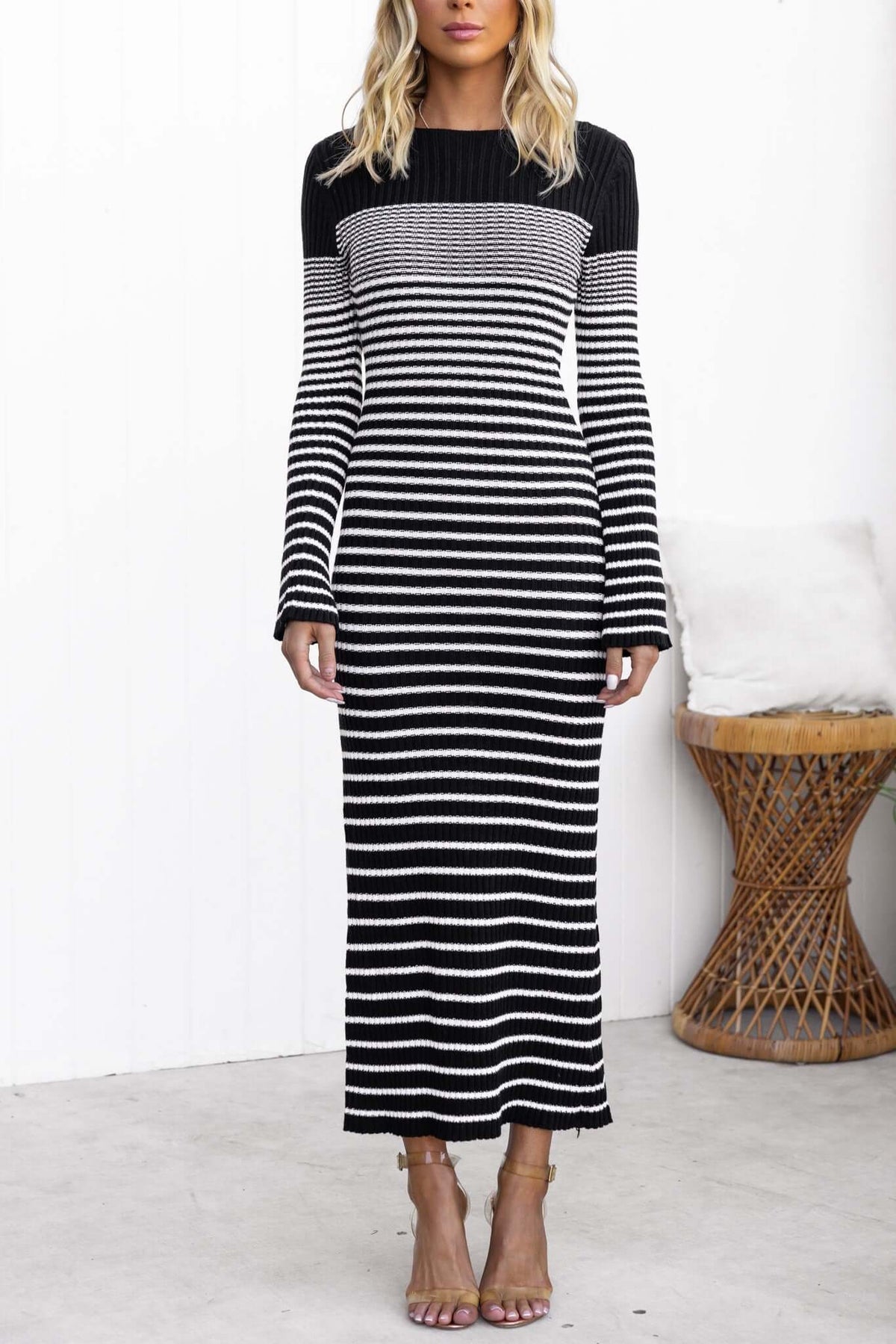 Black and white striped maxi dress with long sleeves and boat neckline, perfect for stylish casual wear.