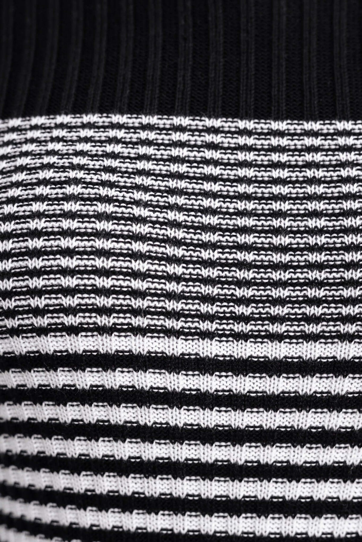 Close-up of black and white striped knit fabric from the Lewin Maxi Dress, showcasing its textured design.