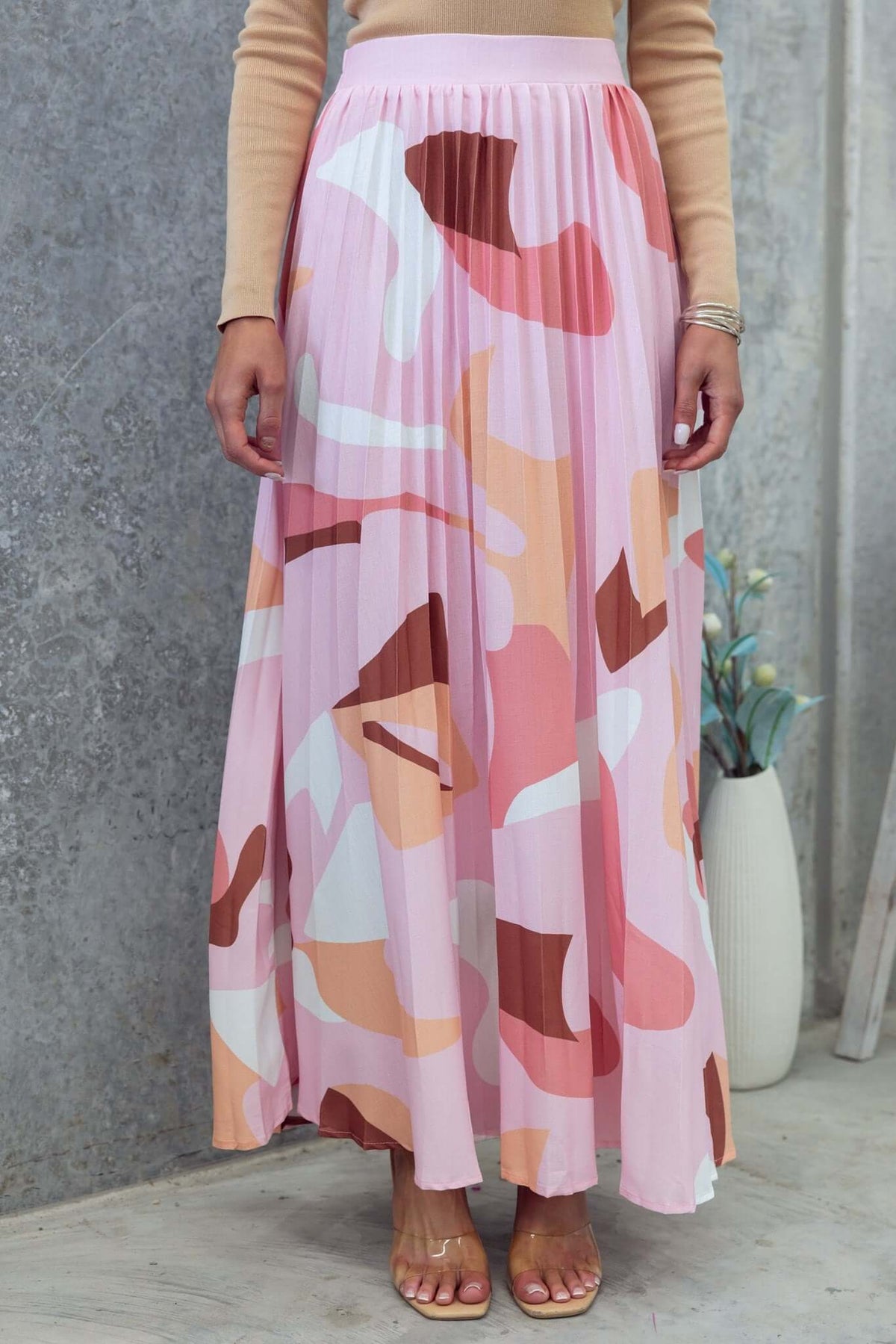Bankston Maxi Skirt featuring a pleated design in pink and earthy tones, perfect for summer styling.