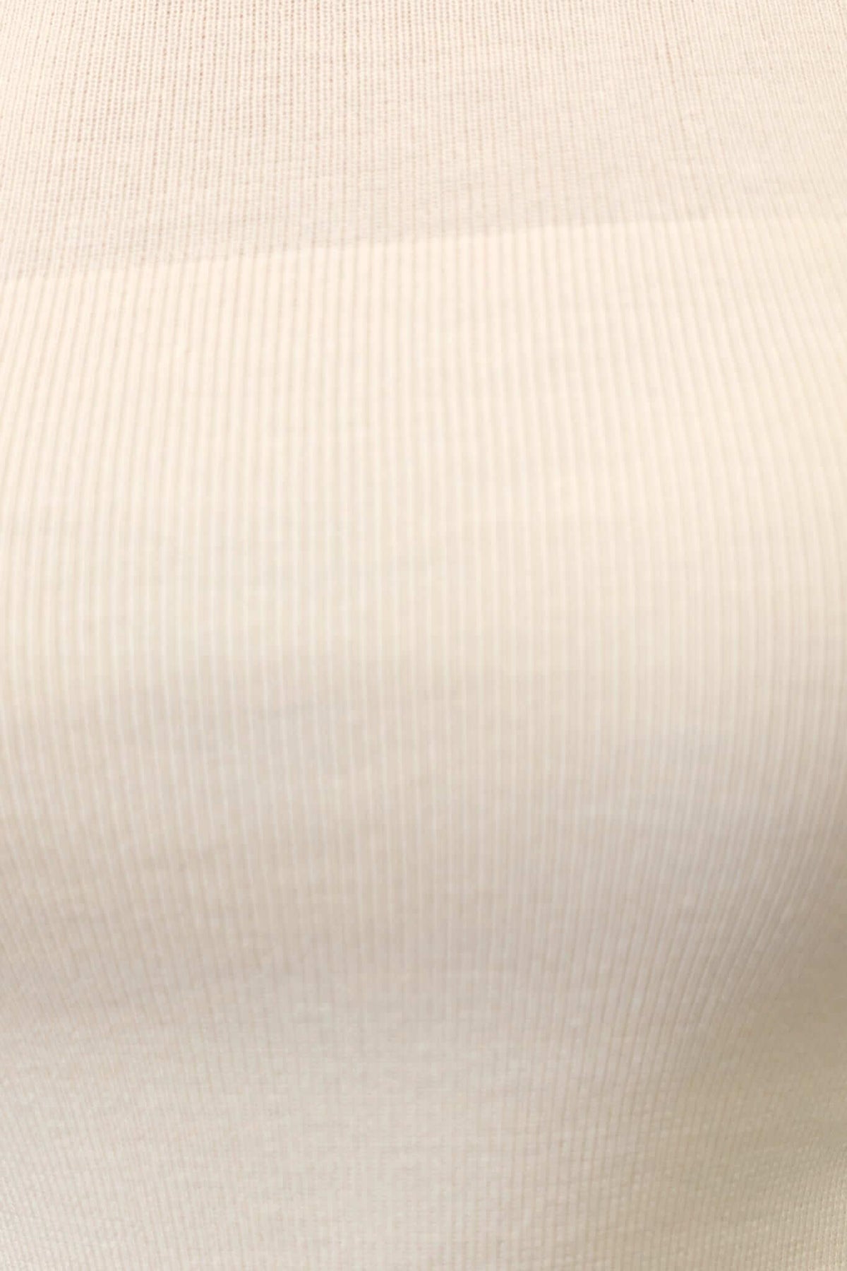 Close-up of Milan Top fabric, showcasing soft, semi-sheer ribbed pattern in a neutral tone.