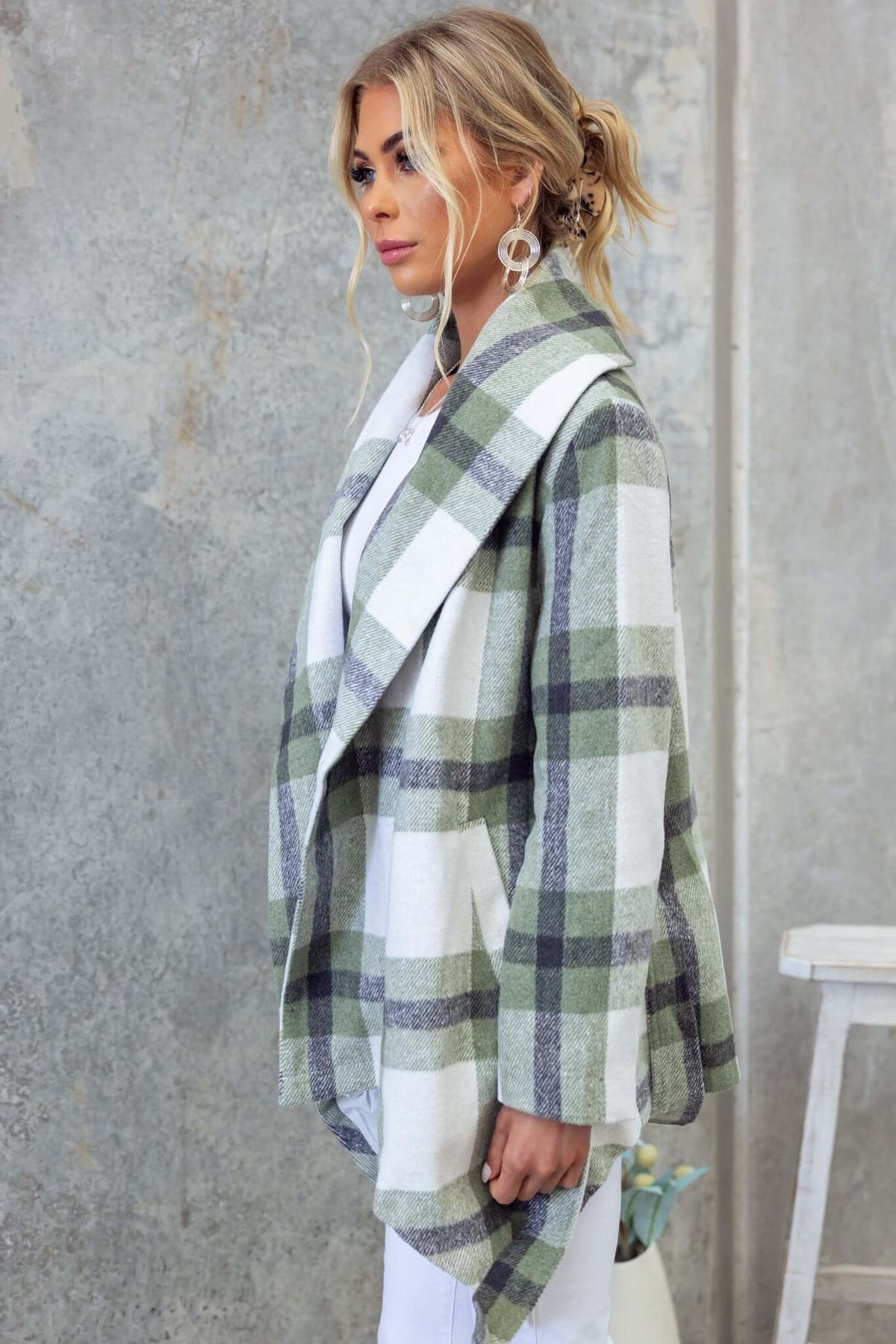 Stylish model wearing Phillips coat in green and white plaid, showcasing a trendy collar and relaxed fit.