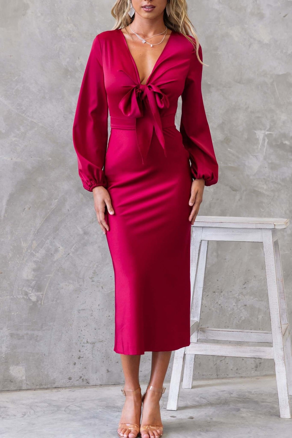 Cremona Midi Dress in fuchsia with tie front, elastic sleeves, and satin finish, showcased by a model.