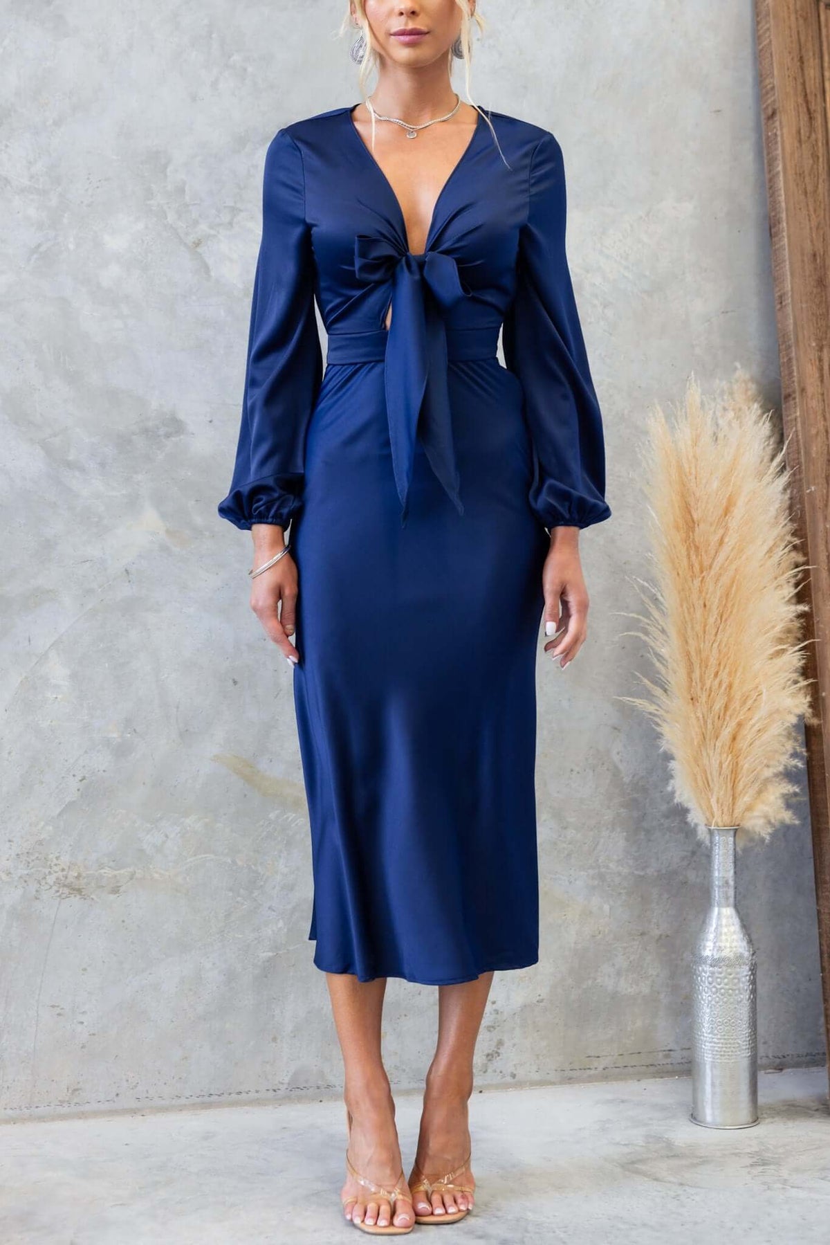 Navy Cremona Midi Dress featuring a tie at the bust and elastic sleeves, perfect for a chic summer look.