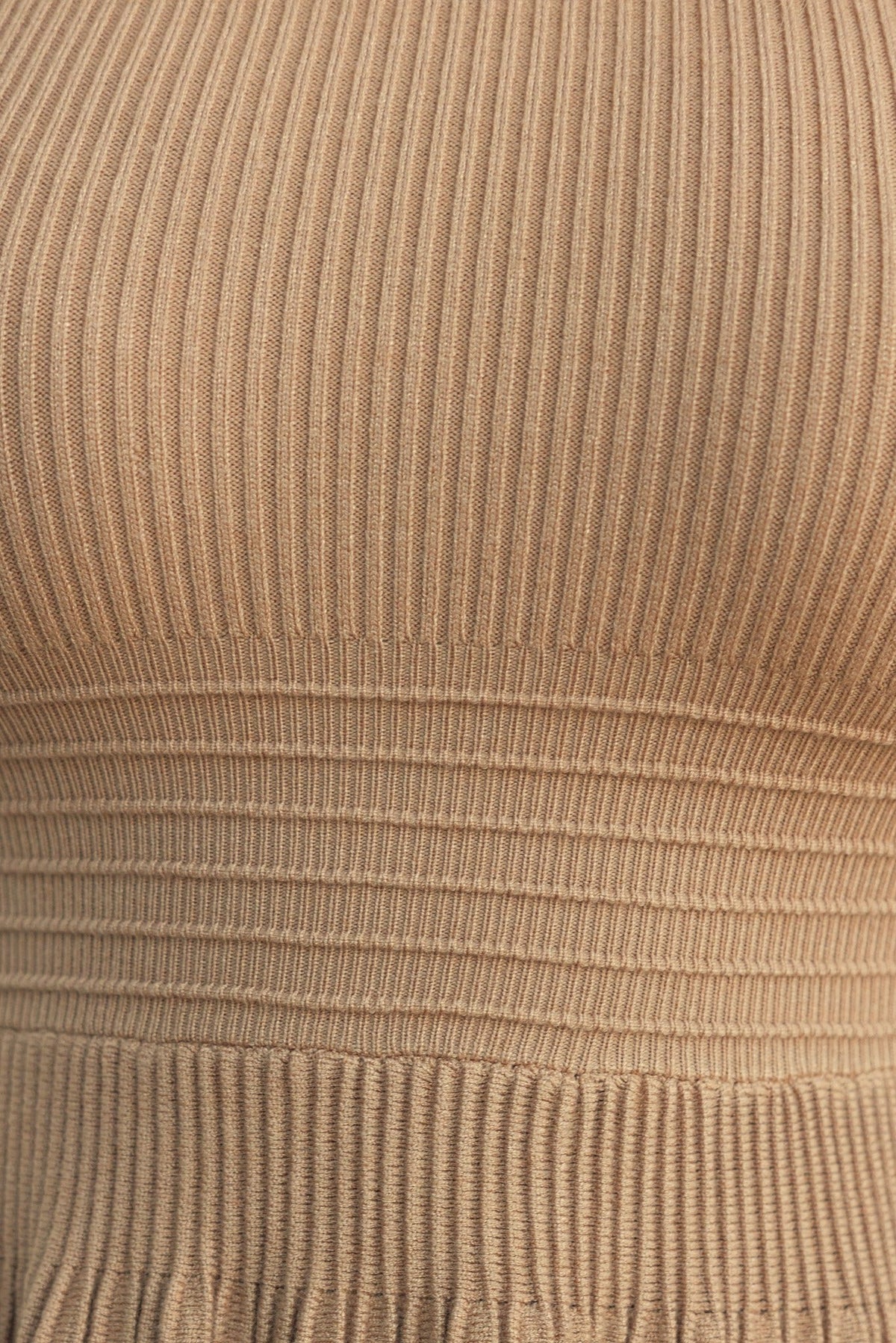 Close-up of ribbed knit material in beige, showcasing the texture and stretch of the Parkley Midi Dress.