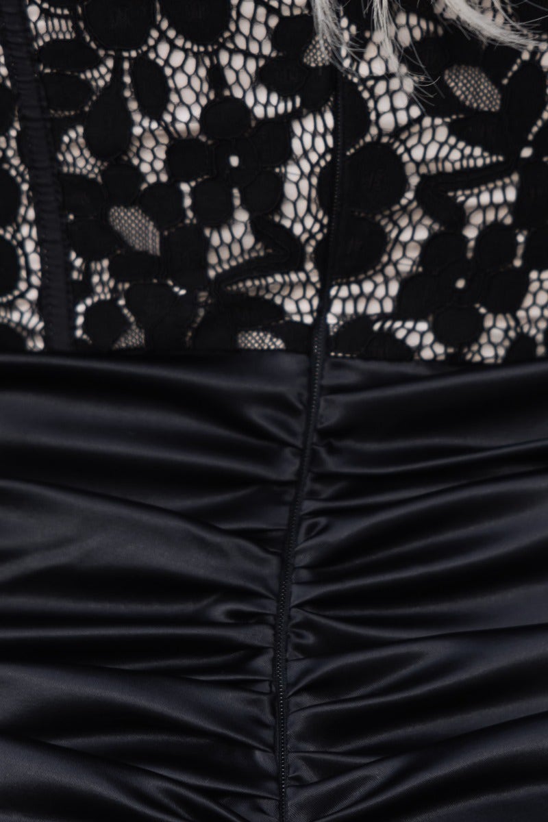 Close-up of Sweet Talker Dress, featuring black lace bodice and satin ruched skirt details.