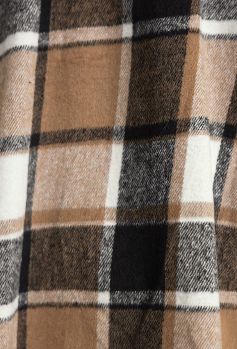 Close-up of a plaid print fabric in brown, black, and white, showcasing a soft texture for a stylish shacket.