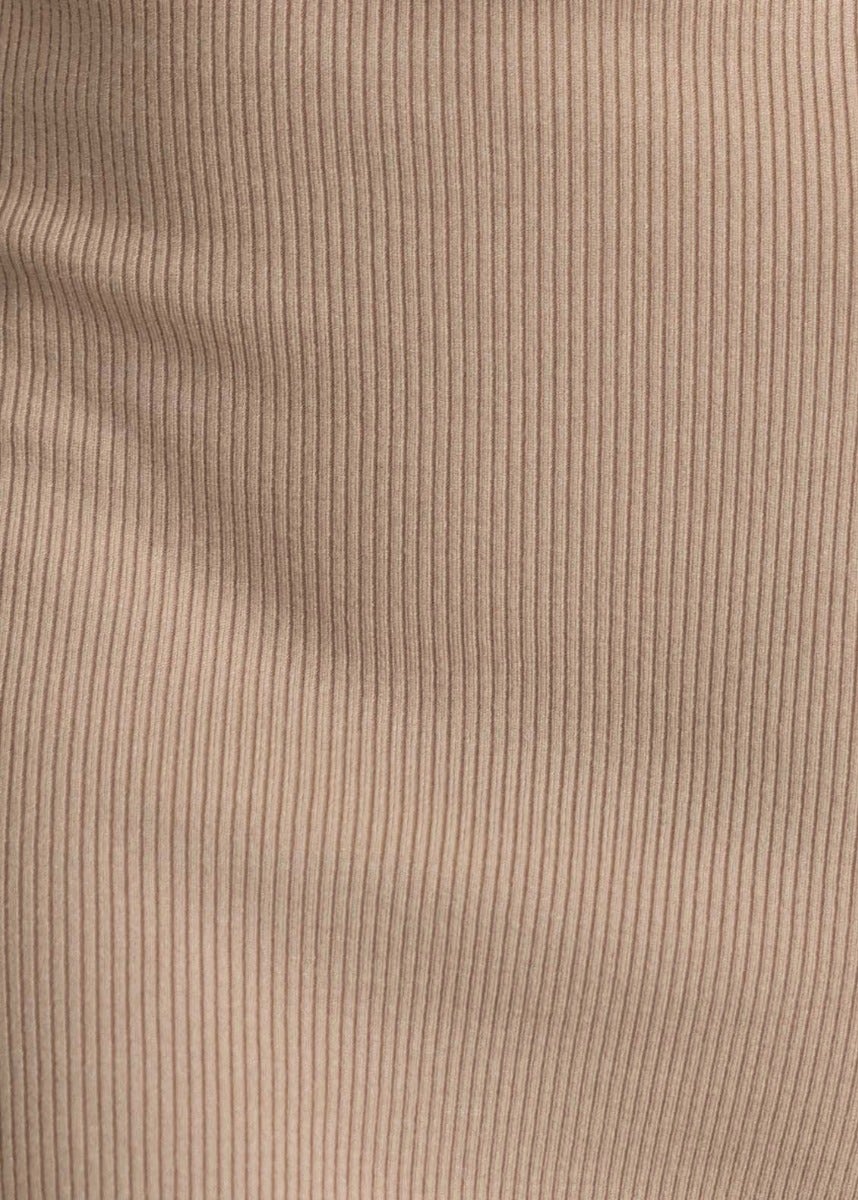 Close-up texture of ribbed knit fabric in beige, showcasing the soft stretch suitable for a stylish midi dress.