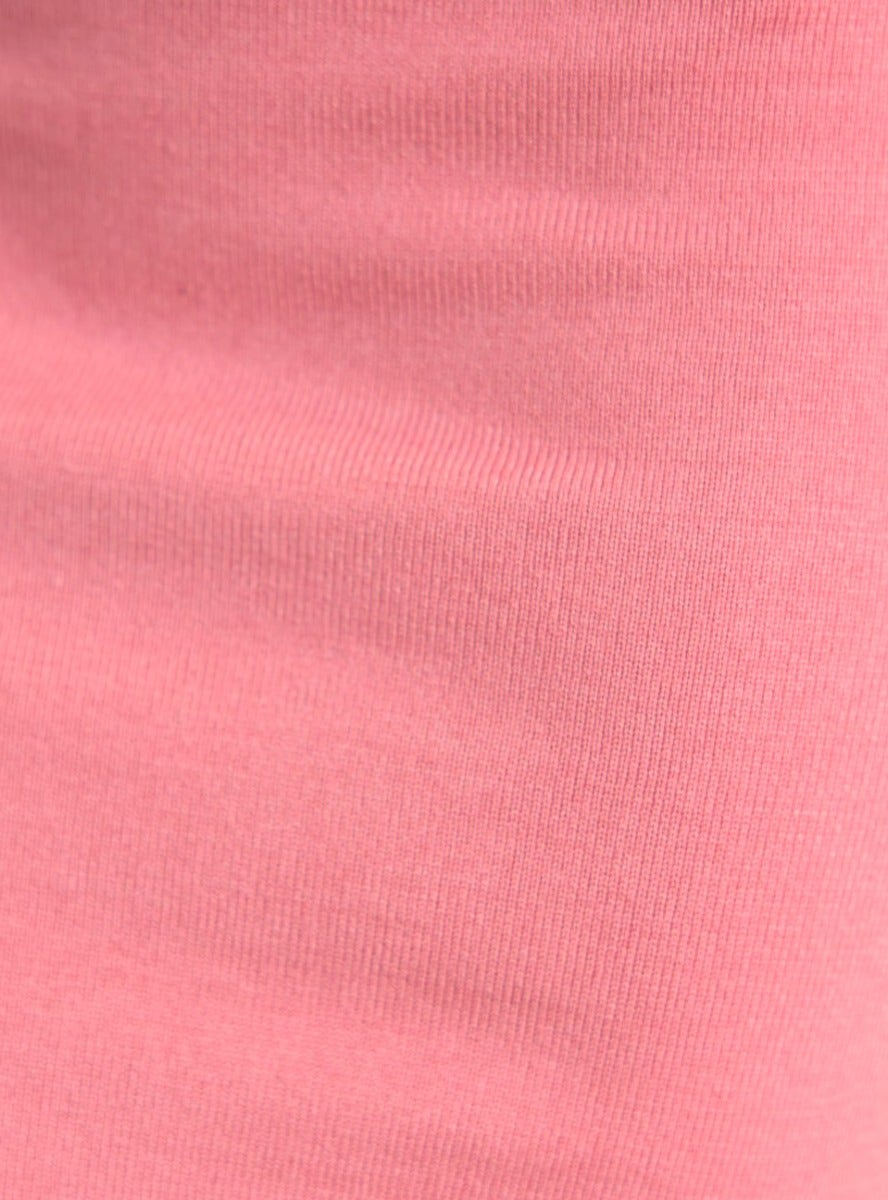 Close-up of soft ribbed knit fabric in light pink, showcasing texture and stretch for Beccie Midi Dress.