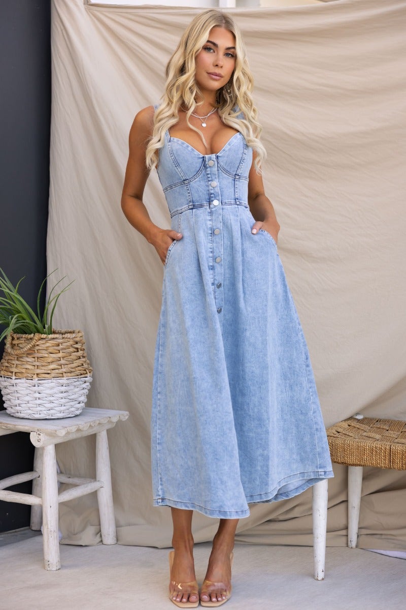 Stylish Tailey Denim Midi Dress featuring a faux button-up front, side pockets, and a flattering fit.