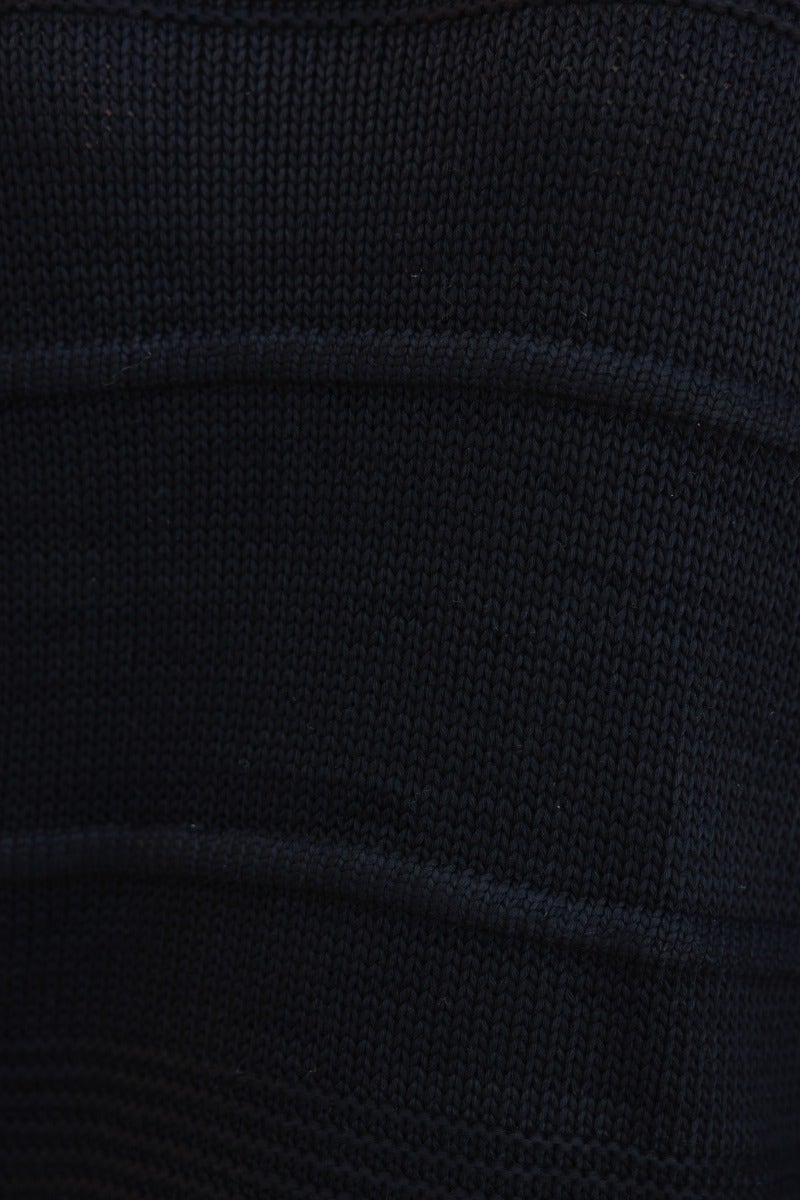 Textured black knit fabric close-up of Adela Knit jumper, showcasing stretch and styling detail.