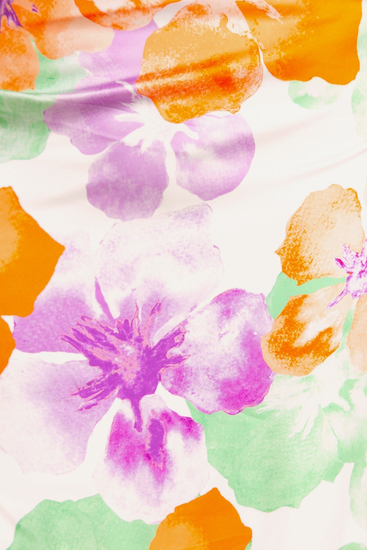Colorful floral pattern featuring purple, orange, and green hues on a white background, perfect for the Vella Top.