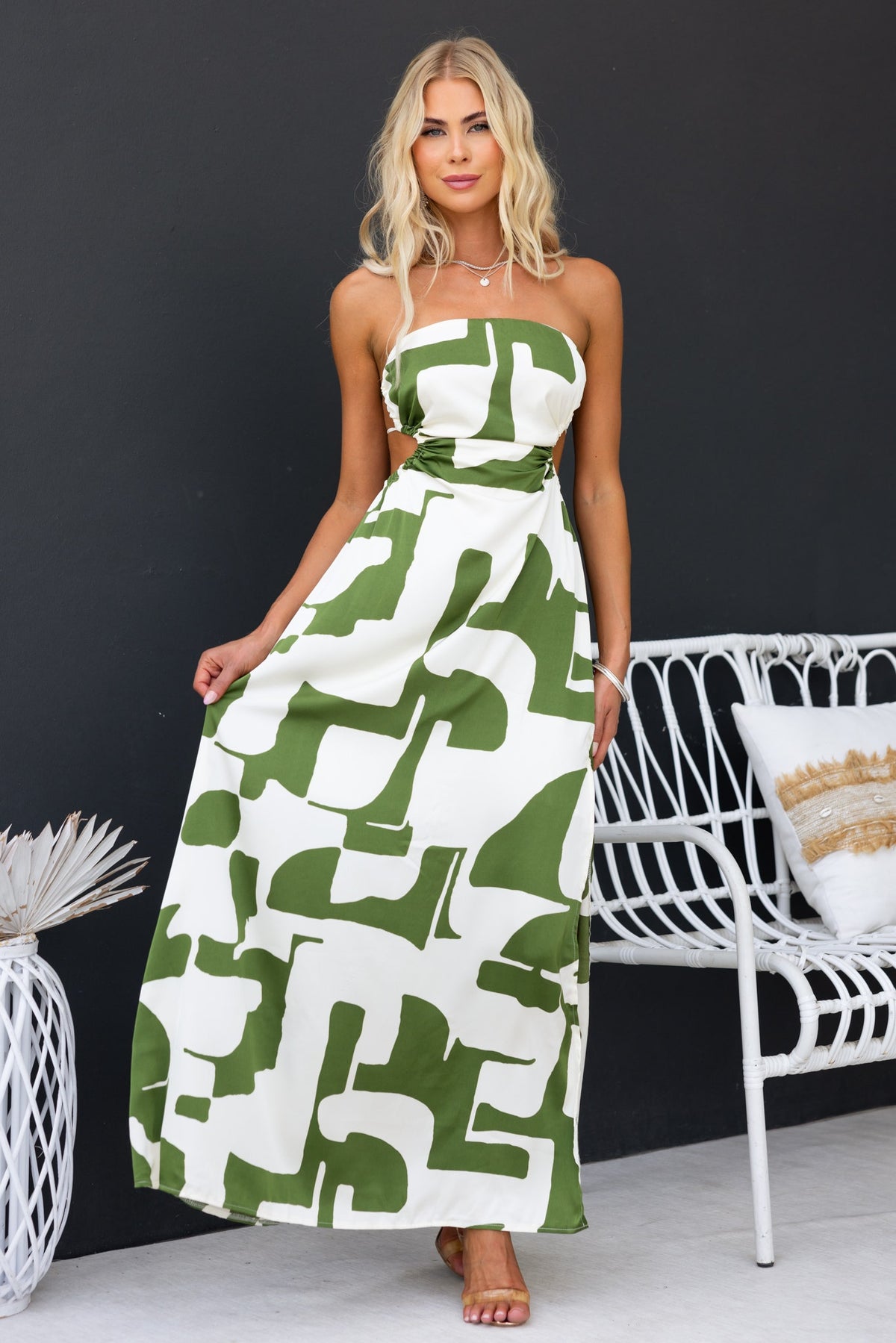 Strapless abstract print maxi dress in green and white, featuring a side split and tie-back design.