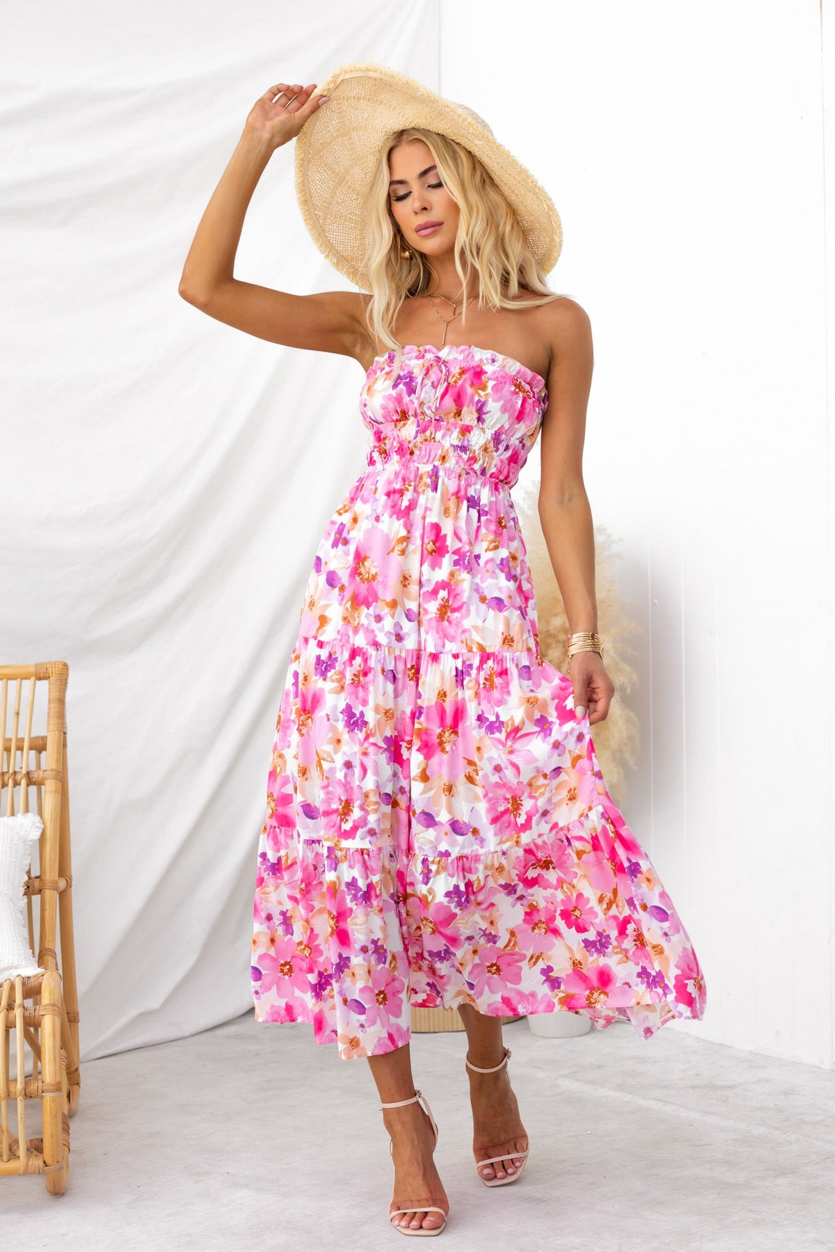 Floral print Qorla midi dress with strapless design and tie detail, perfect for summer outings.