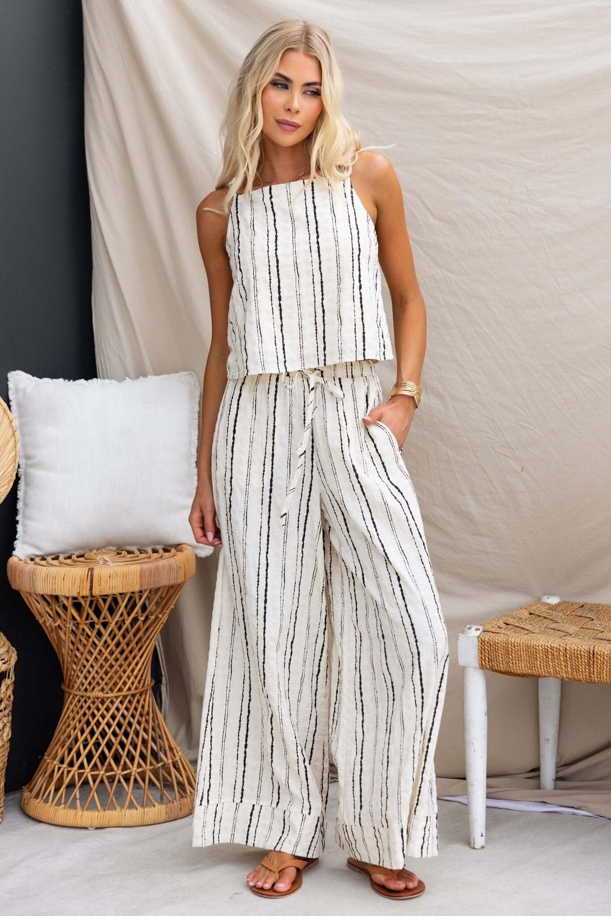 Model wearing Frances Linen Pants with elastic waistband, showcasing casual style and pockets.