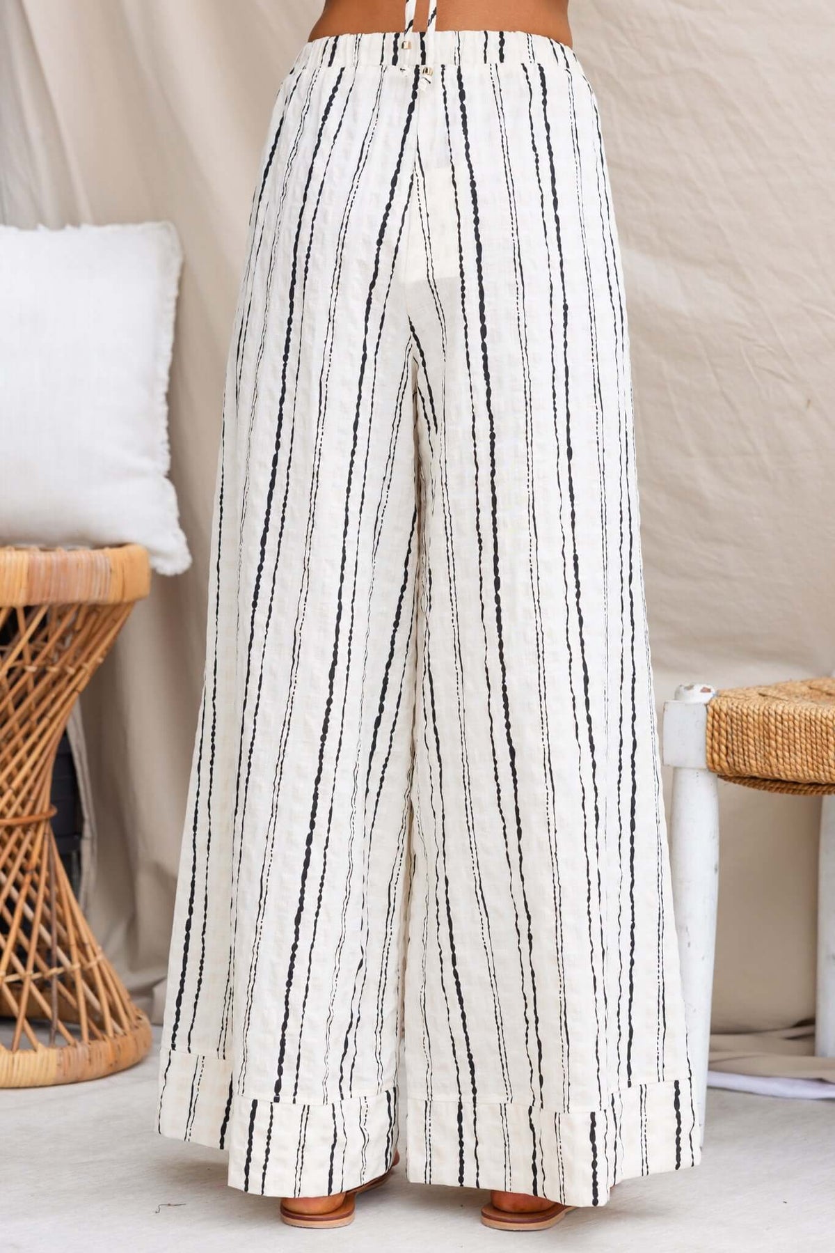 Frances Pants featuring linen fabric, elastic waistband, side pockets, and a stylish striped design.
