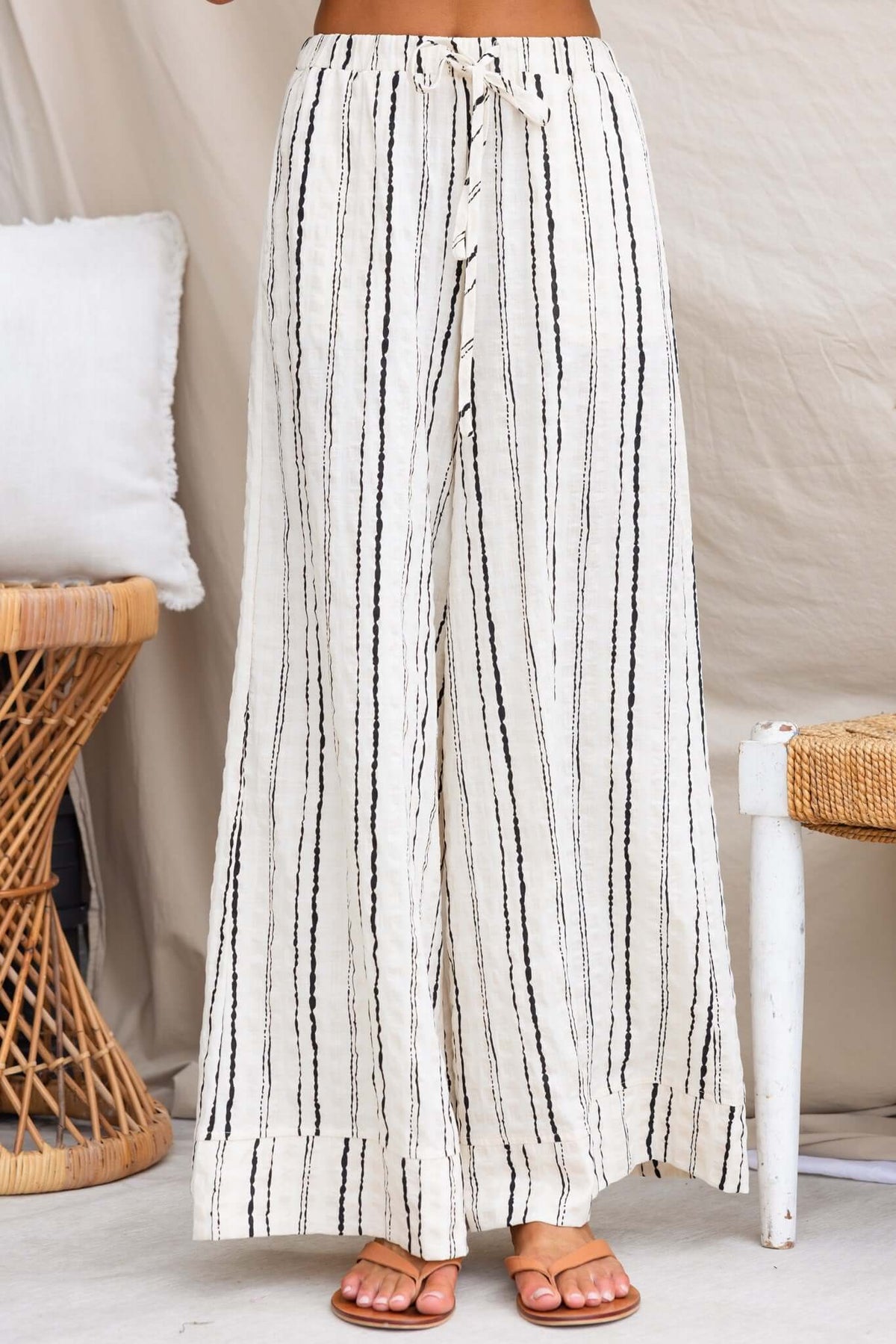 Frances Pants: lightweight linen trousers with an elastic waistband and pockets, featuring a striped design.