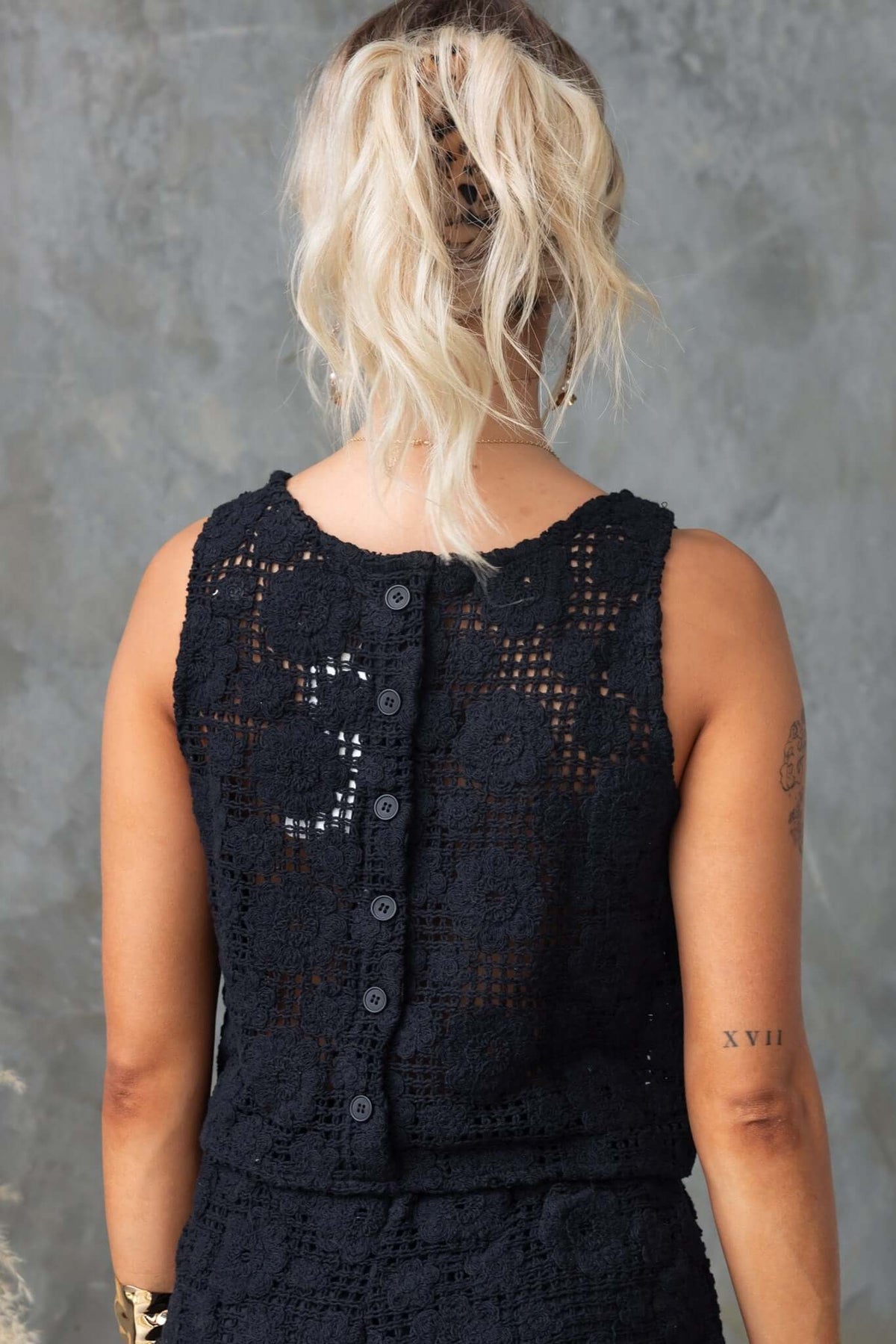 Back view of Fenny Top featuring faux buttons and a crochet design, perfect for a relaxed style.