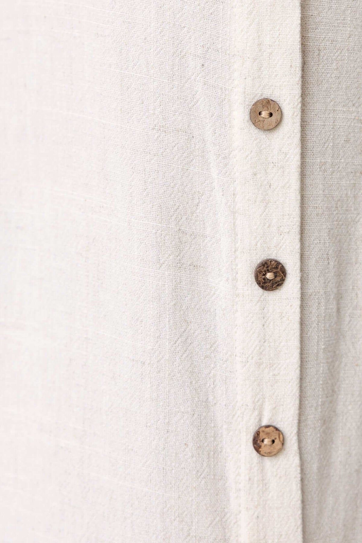 Close-up of Damico Maxi Dress fabric featuring faux buttons and textured linen blend.