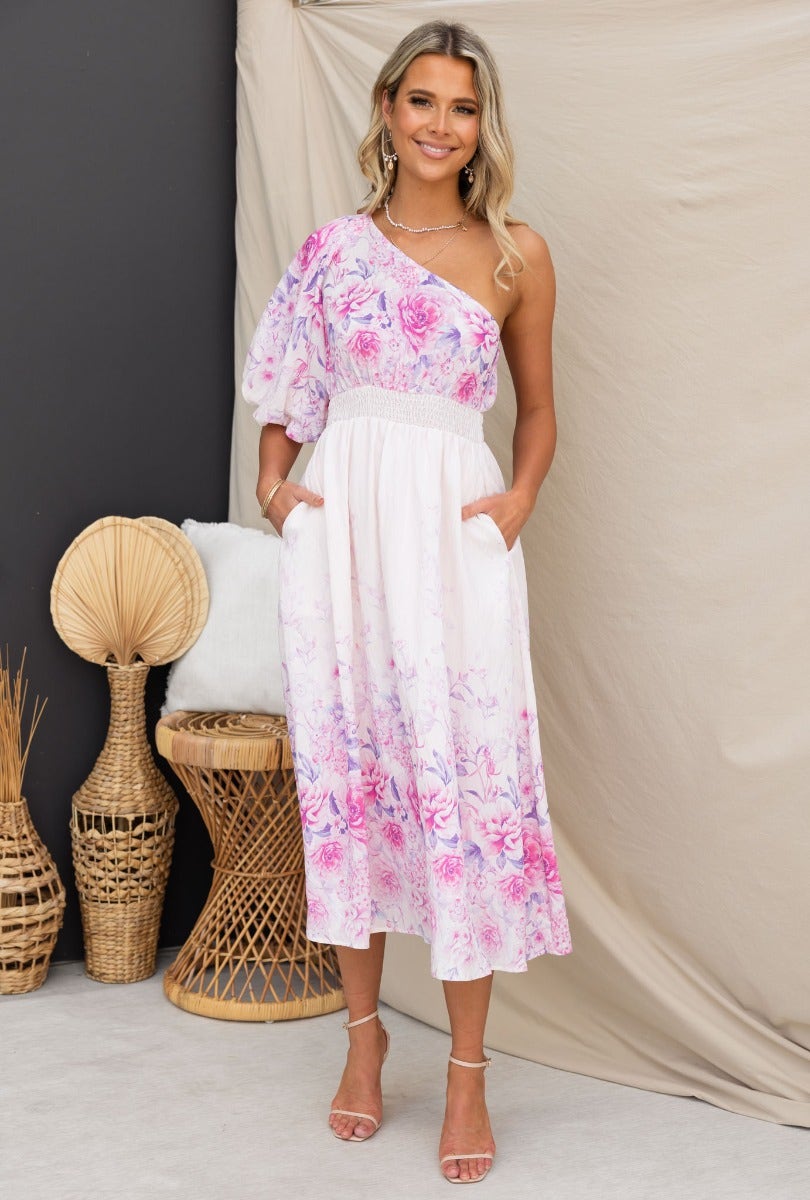 Aleyna Midi Dress featuring floral print, one-shoulder neckline, elastic waistband, and pockets, styled for a chic look.