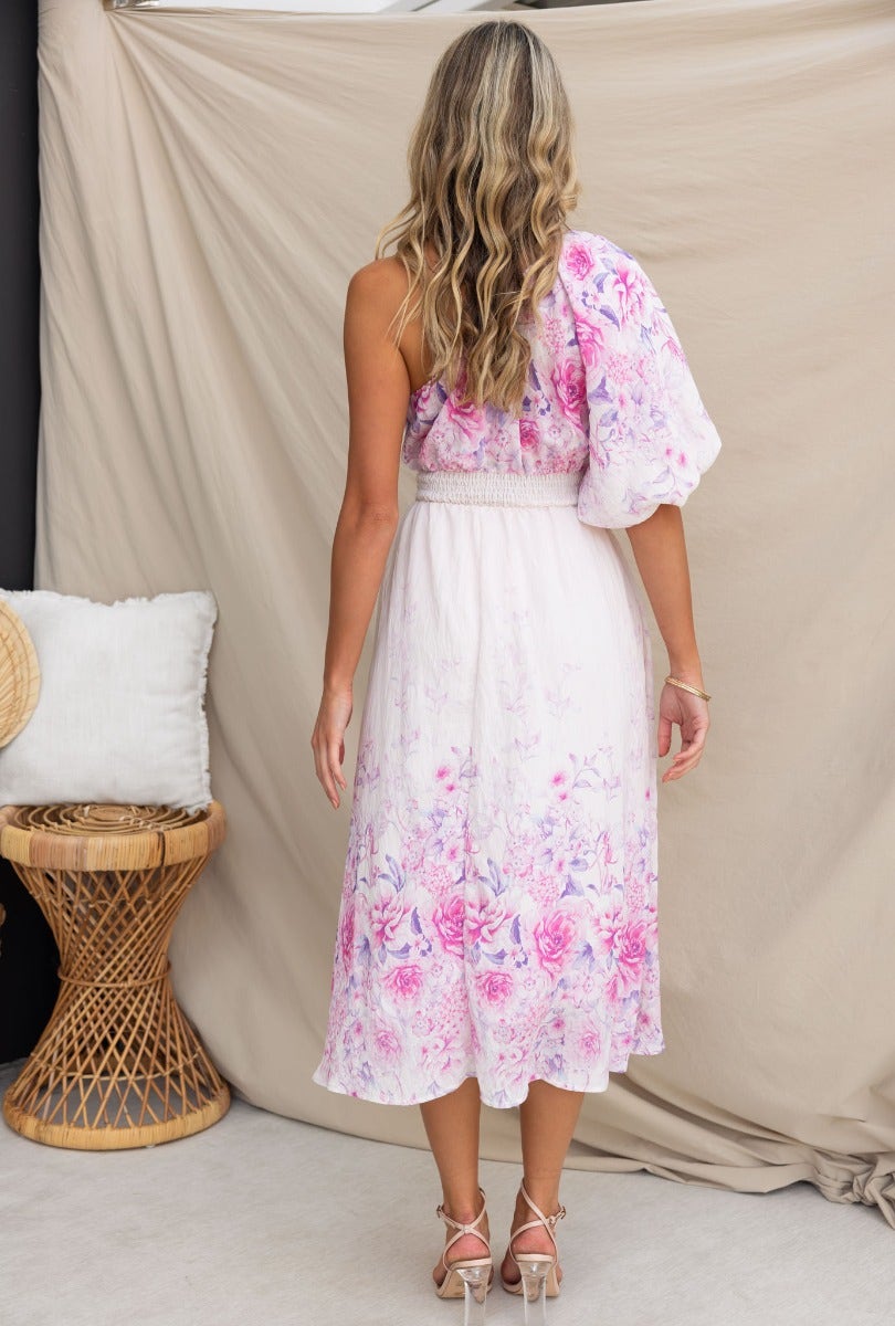 Back view of Aleyna Midi Dress featuring floral print, one-shoulder design, and elastic waistband.