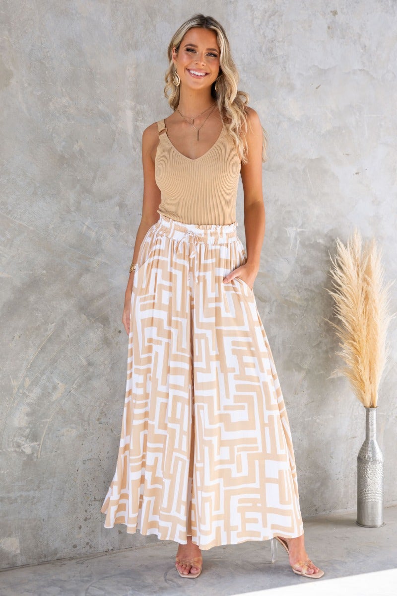 Esmie Pants: Stylish print wide-leg pants with an elastic waistband, pockets, and a relaxed fit.