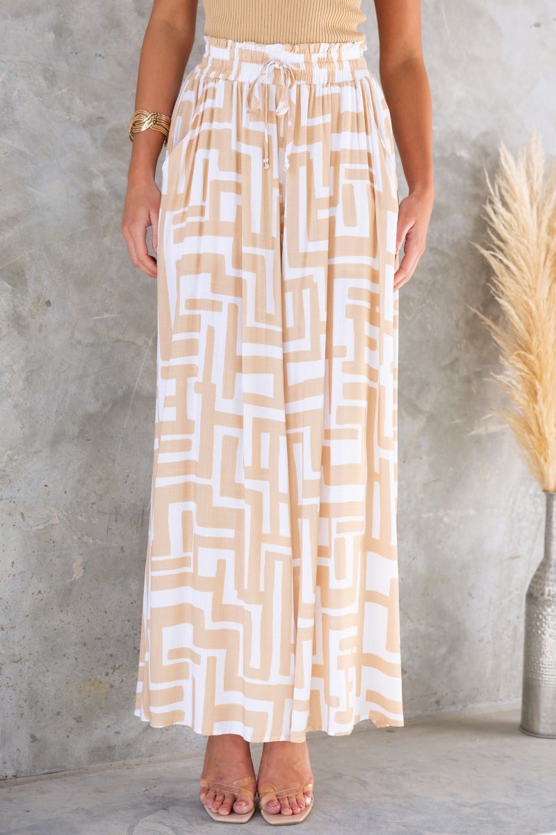 Esmie Pants: stylish print pants with elastic waistband and drawstring, perfect for a casual look.