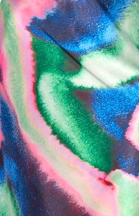 Colorful abstract fabric pattern in shades of green, blue, and pink, ideal for a trendy dress or apparel design.