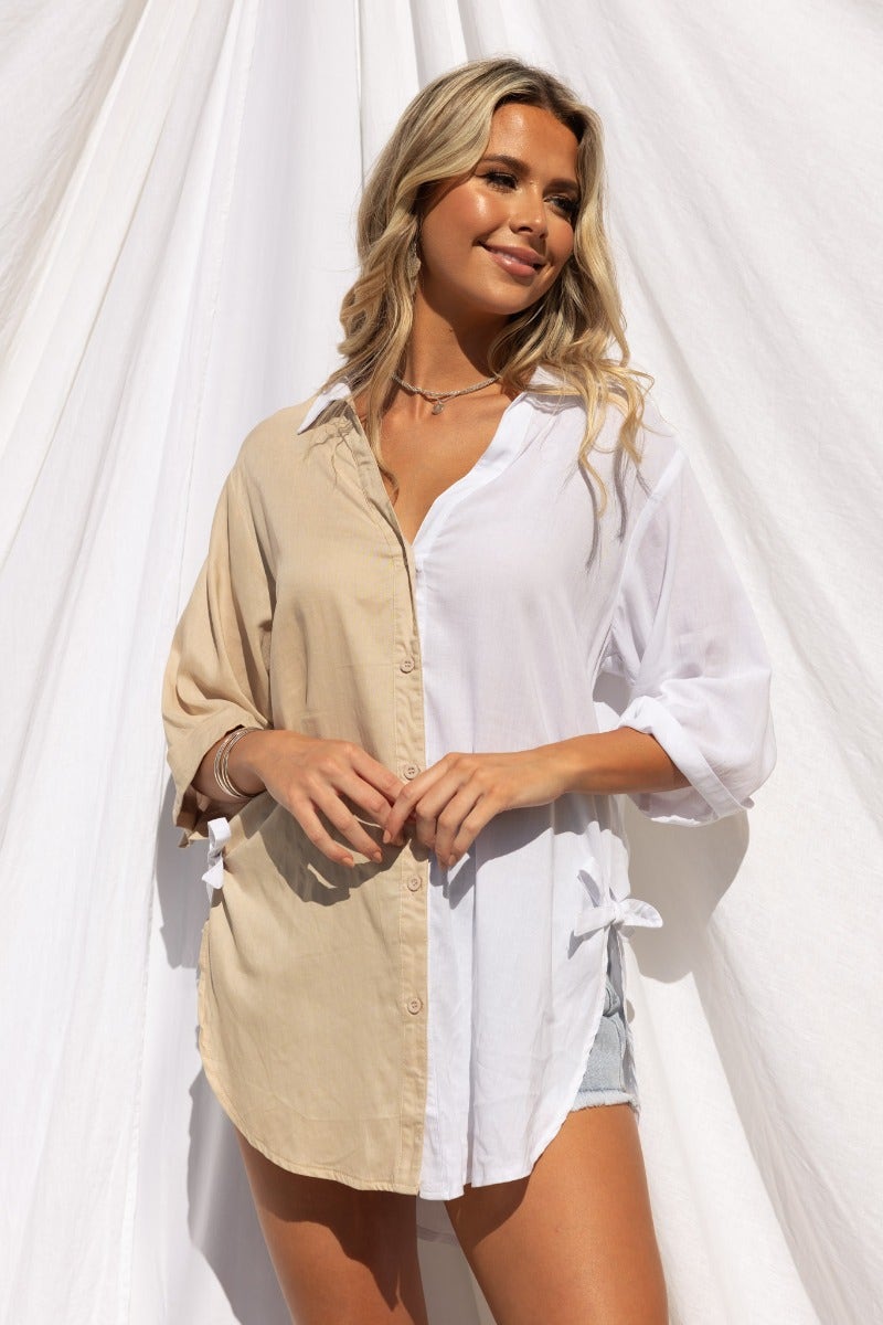 Honey Shirt in beige and white with rolled sleeves, button-up front, and ties at sides, perfect for a casual look.