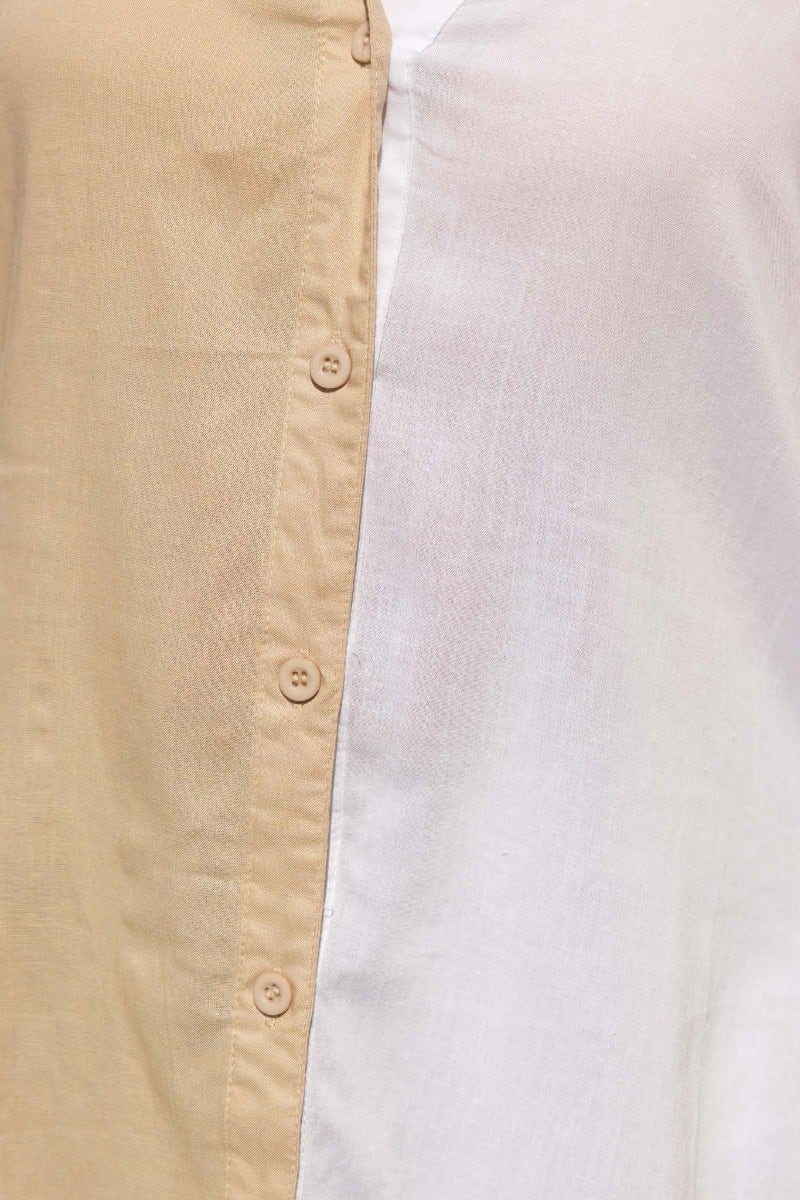 Close-up of the Honey Shirt featuring a button-up front with beige and white fabric panels.