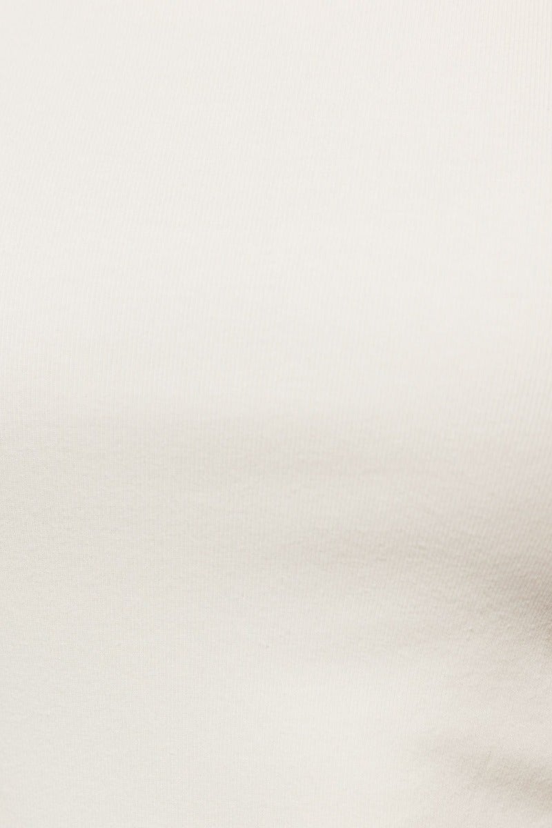 Close-up of a soft, white cotton blend fabric with slight stretch, ideal for casual tops or comfortable wear.