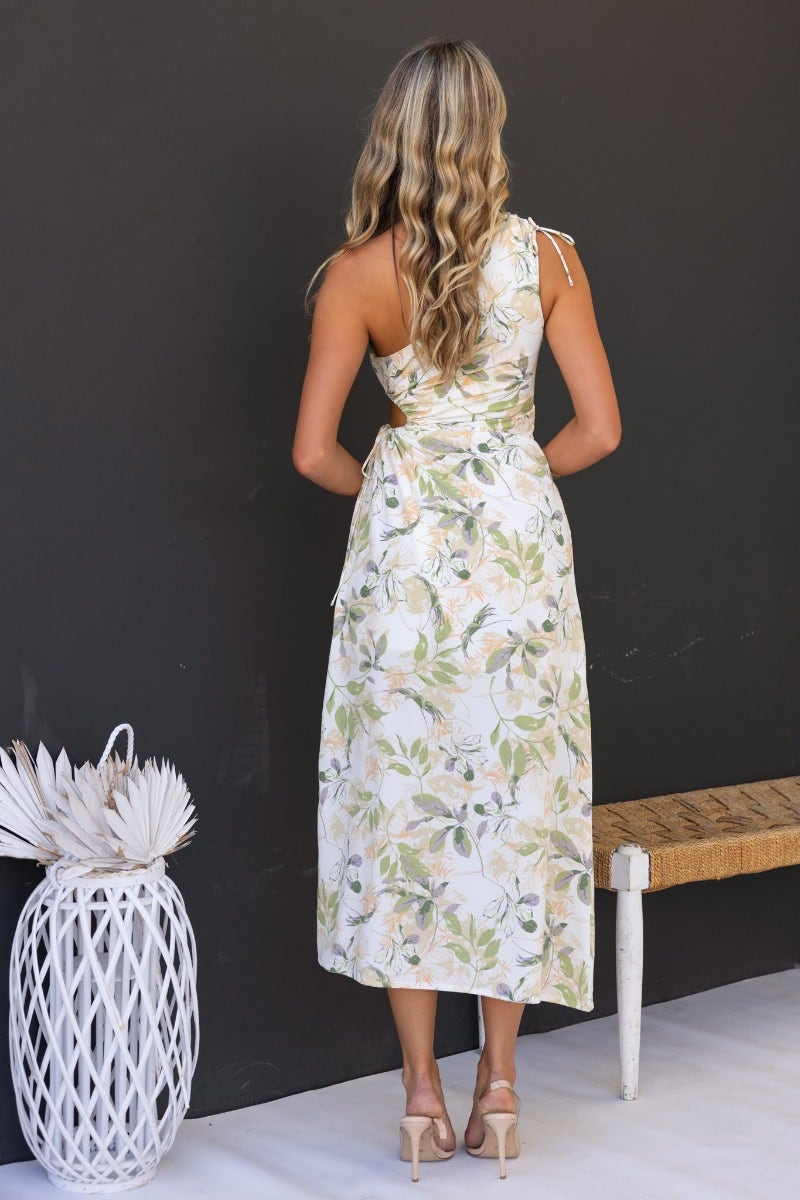 Back view of Ronan Maxi Dress, featuring floral print, one-shoulder design, adjustable ruching, and drawstring waist.
