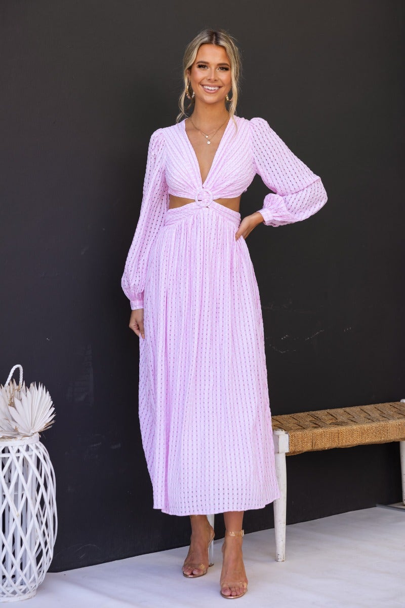 Devine Maxi Dress in light pink with open plunge neckline and cut-out waist, perfect for summer events.