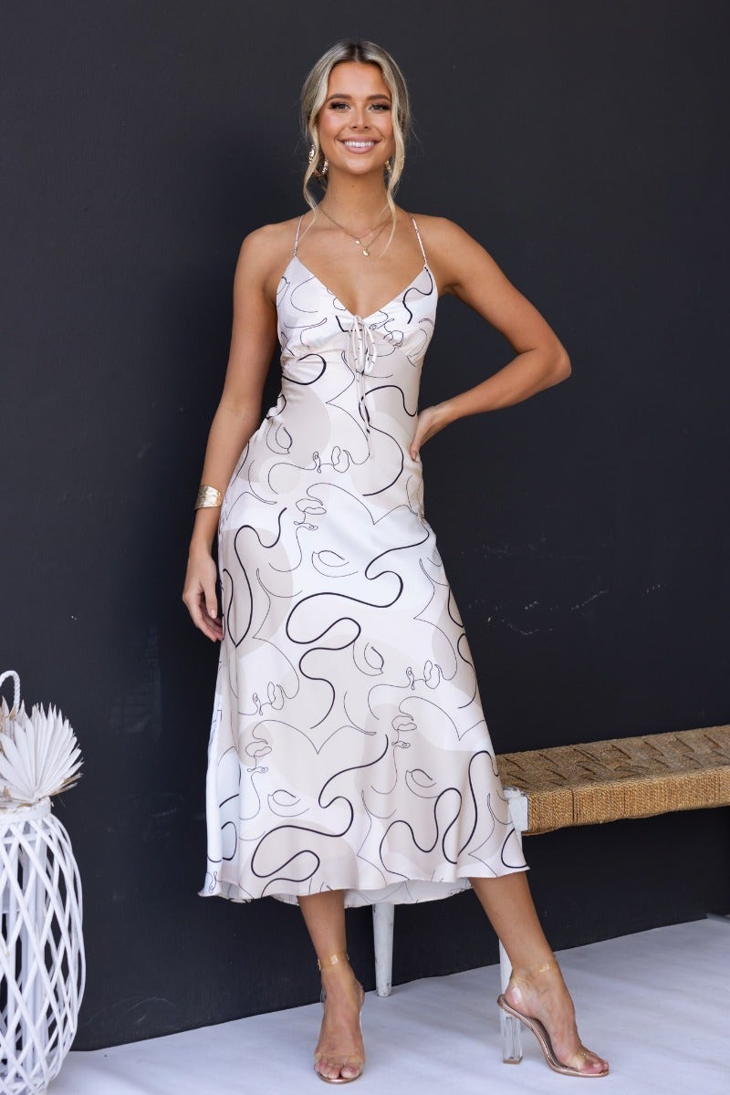 Derya Maxi Dress in satin with adjustable straps, featuring a chic cross-over back and stylish tie detail at the bust.