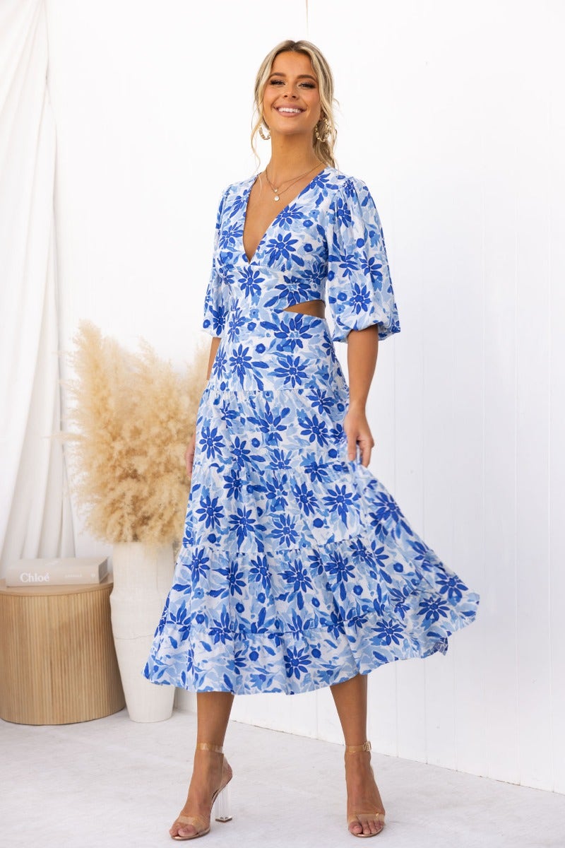 Abeila floral print maxi dress, V-neckline and cut-out waist, styled with nude heels for a summer look.