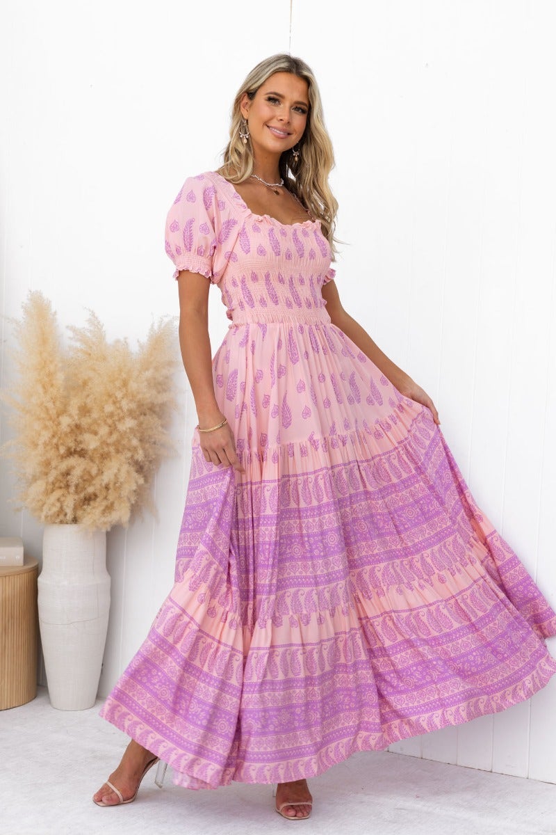 Model wearing the Right Time Maxi Dress featuring multi-colour patterns with puff sleeves and tiered design.