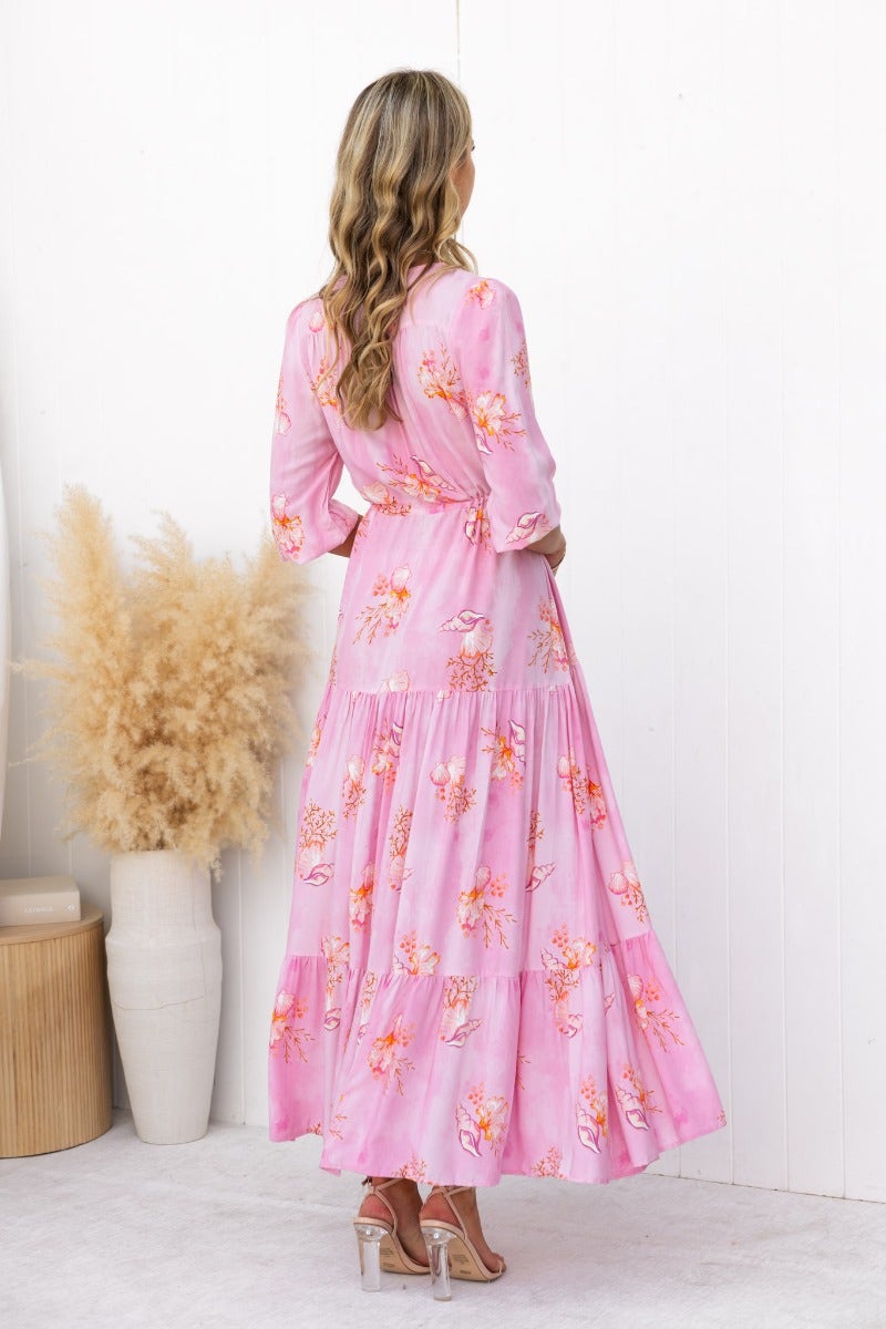 Model wearing Yespia floral print maxi dress in pink, showing back view with adjustable drawstring and elastic cuffs.