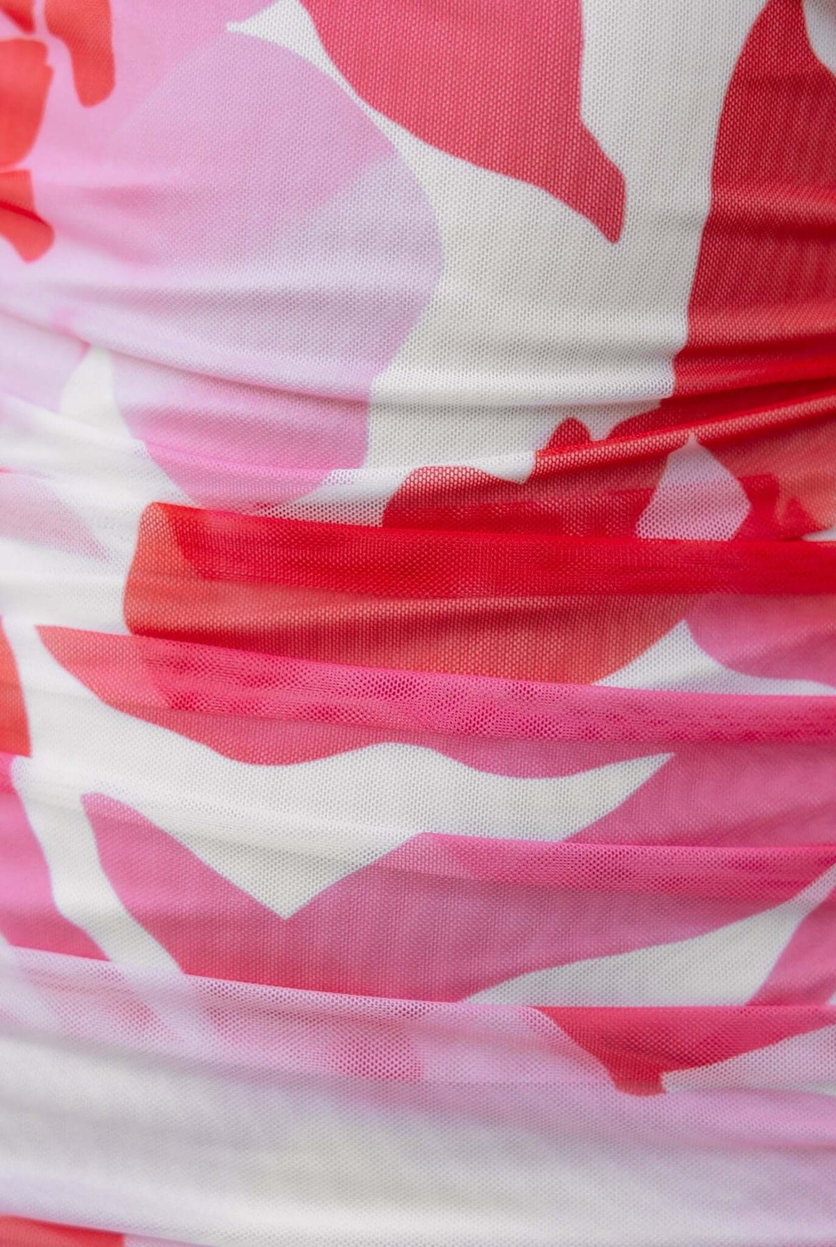 Close-up of pink and white floral mesh fabric texture of the Oaklyn Maxi Dress, featuring gathered detailing.