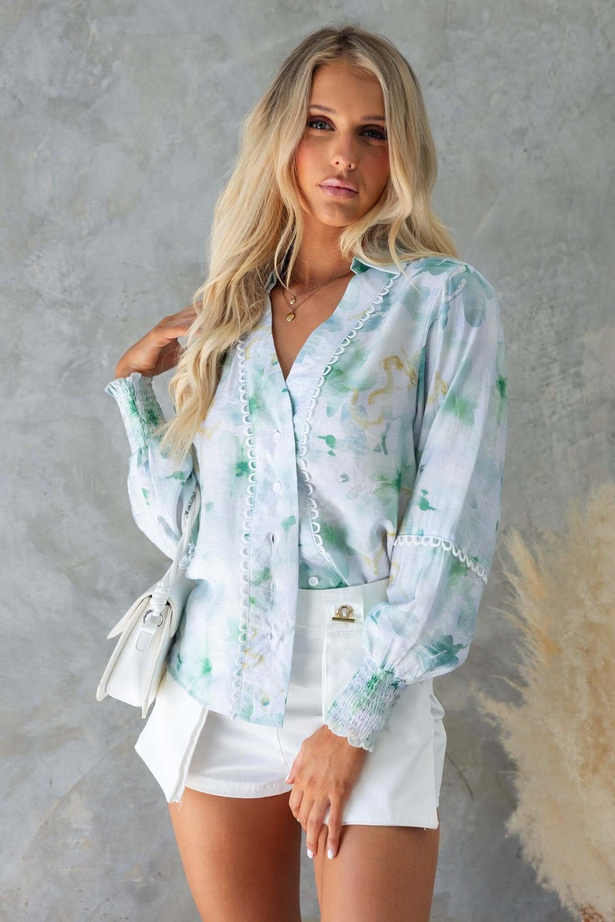 Kellee Shirt featuring a collar, button-up front, and elastic sleeves in a stylish green watercolor print.