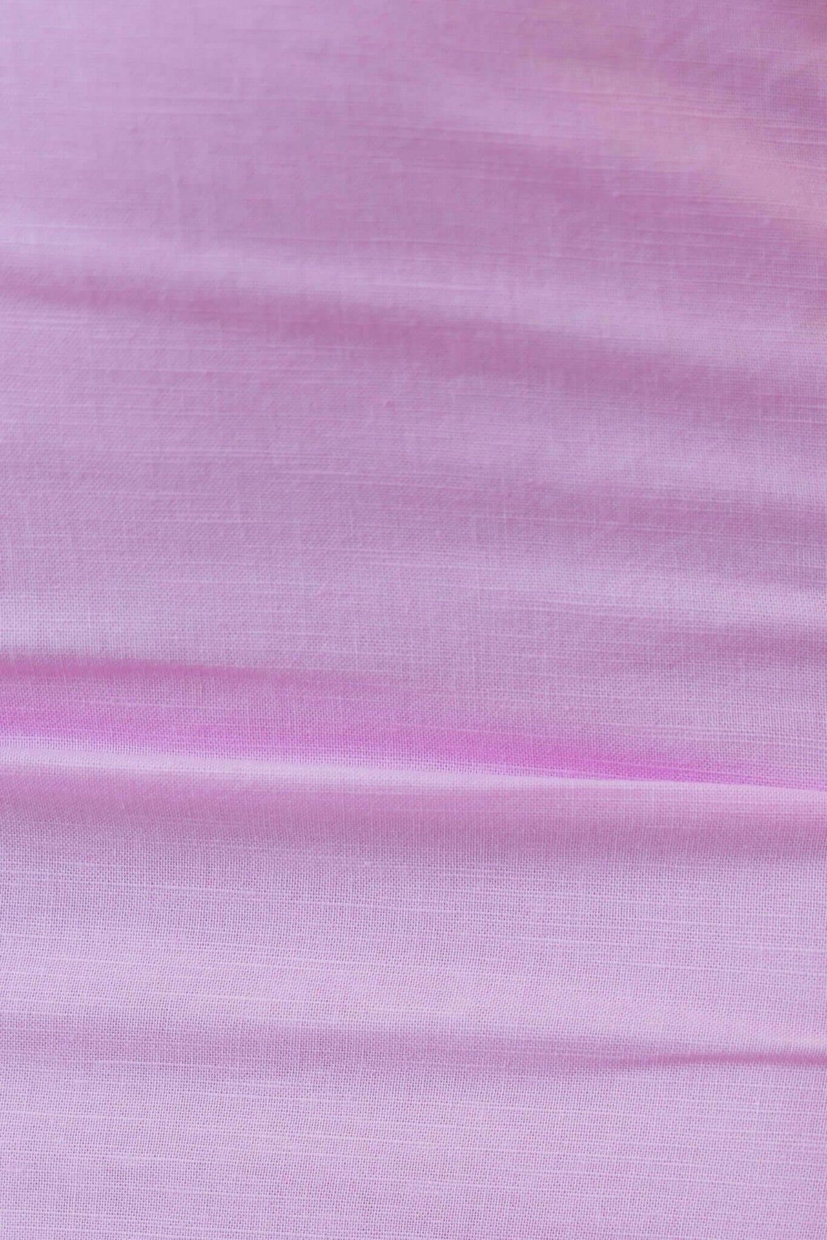 Close-up of soft pink linen fabric featuring subtle texture, ideal for the Annerly Maxi Dress.