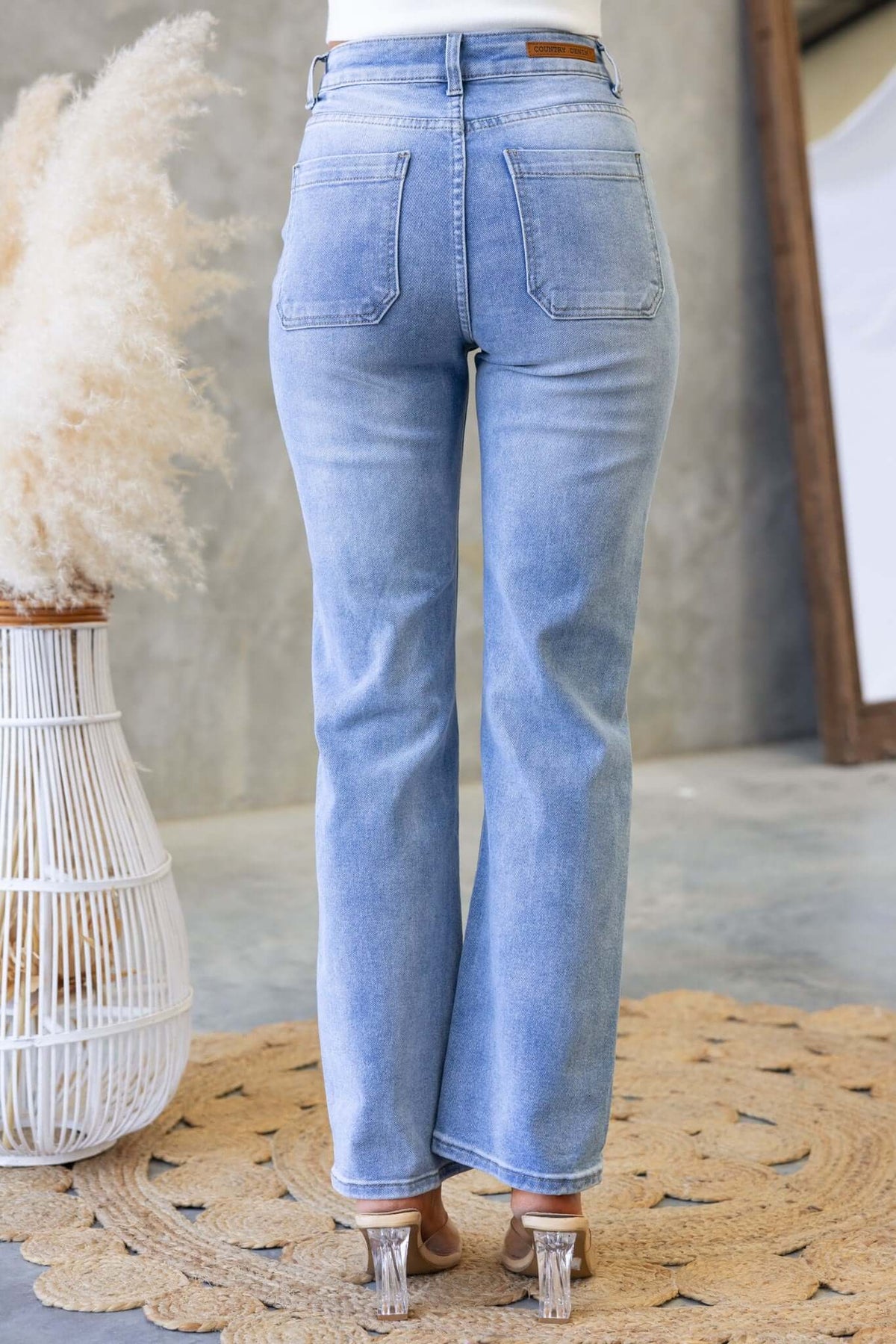 Back view of Tekin Jeans featuring distressed details and a relaxed fit, perfect for casual wear.