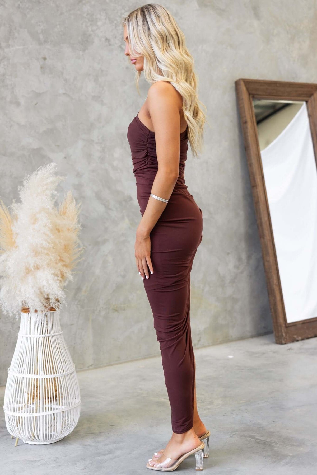 Coco Midi Dress in brown featuring ruching detail, gel strip at the top, and a fitted silhouette.