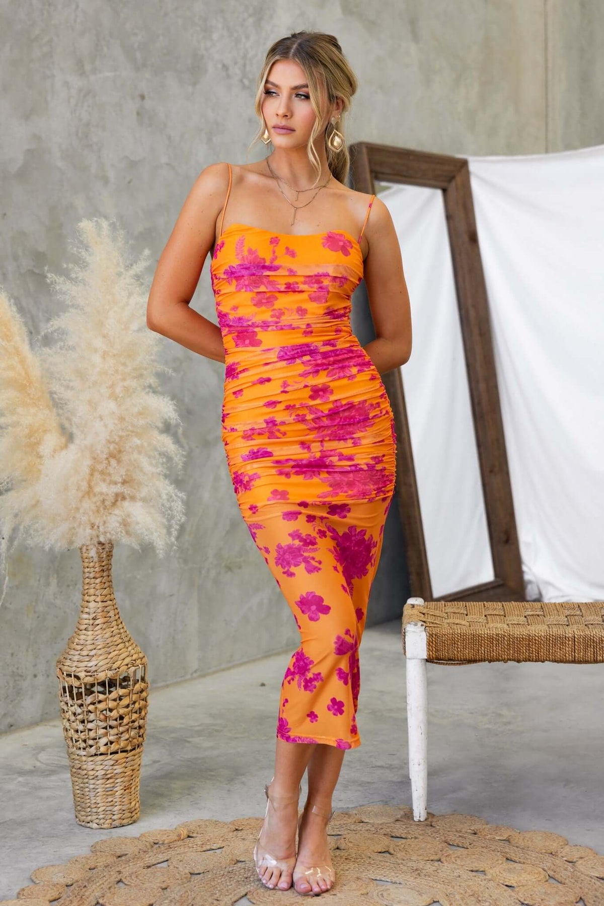 Azriel Midi Dress featuring a vibrant orange and pink floral design, stretchy mesh overlay, and adjustable straps.