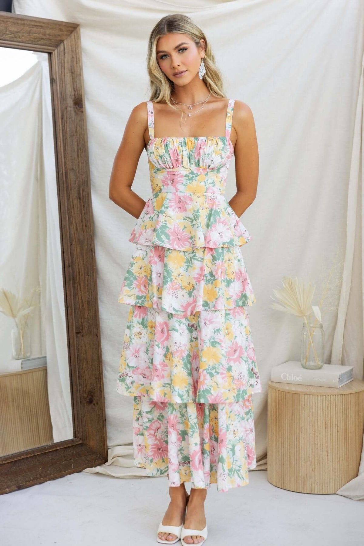 Peyton Maxi Dress features multi-tiered ruffle skirt in floral print, adjustable straps, and an elegant silhouette.