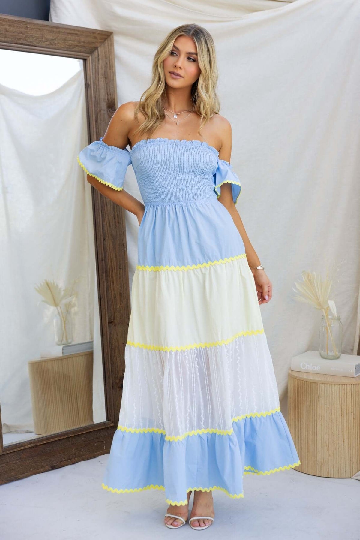 Palmer Maxi Dress, blue and white colorblock design, elastic bodice, model wearing size XS in a styled setting.